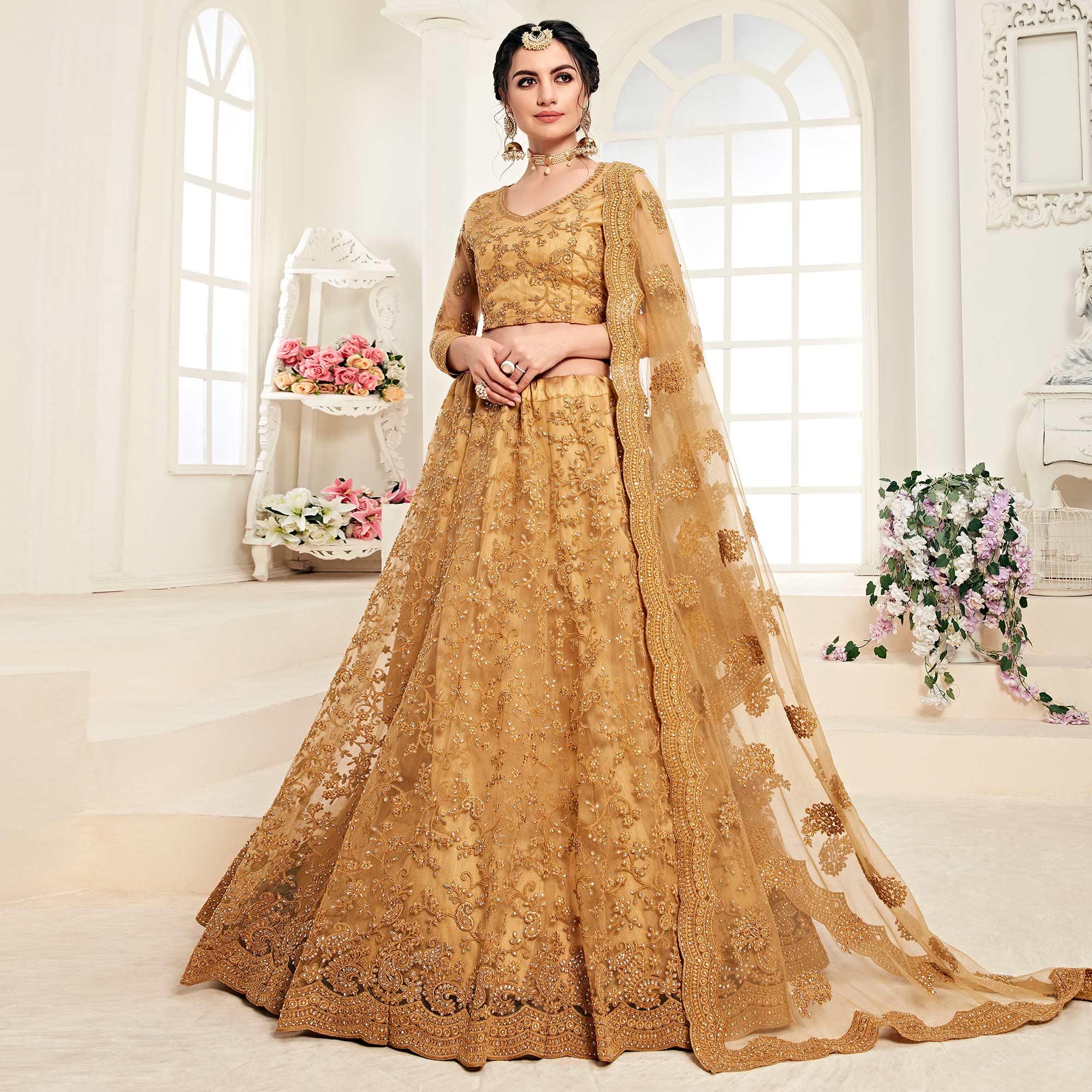 Peachmode Engrossing Mustard Yellow Colored Cording Embroidery Wedding Wear Net Lehenga Choli