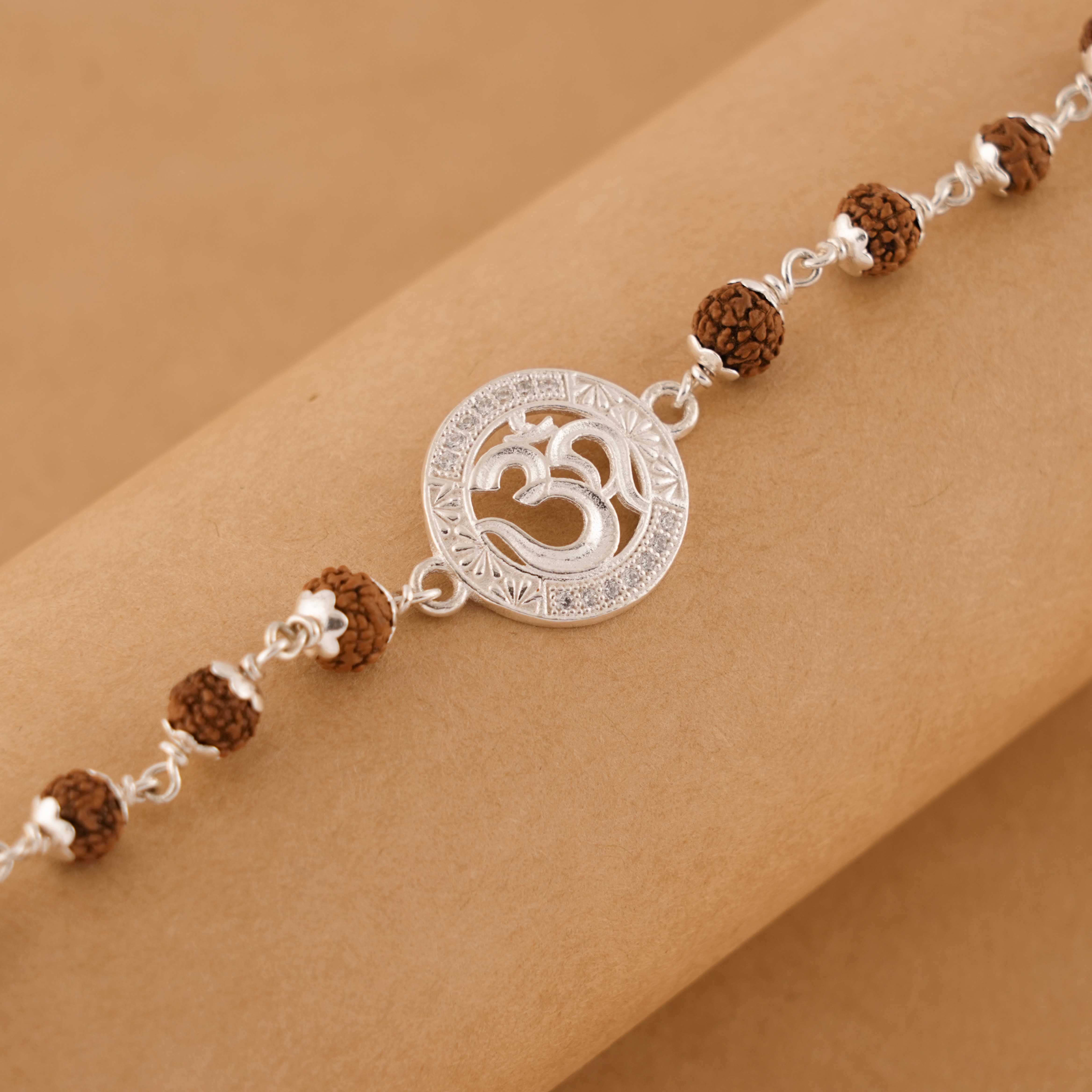 Prinjal Jewellers Rudraksha Silver bracelet with Om Single Line for men