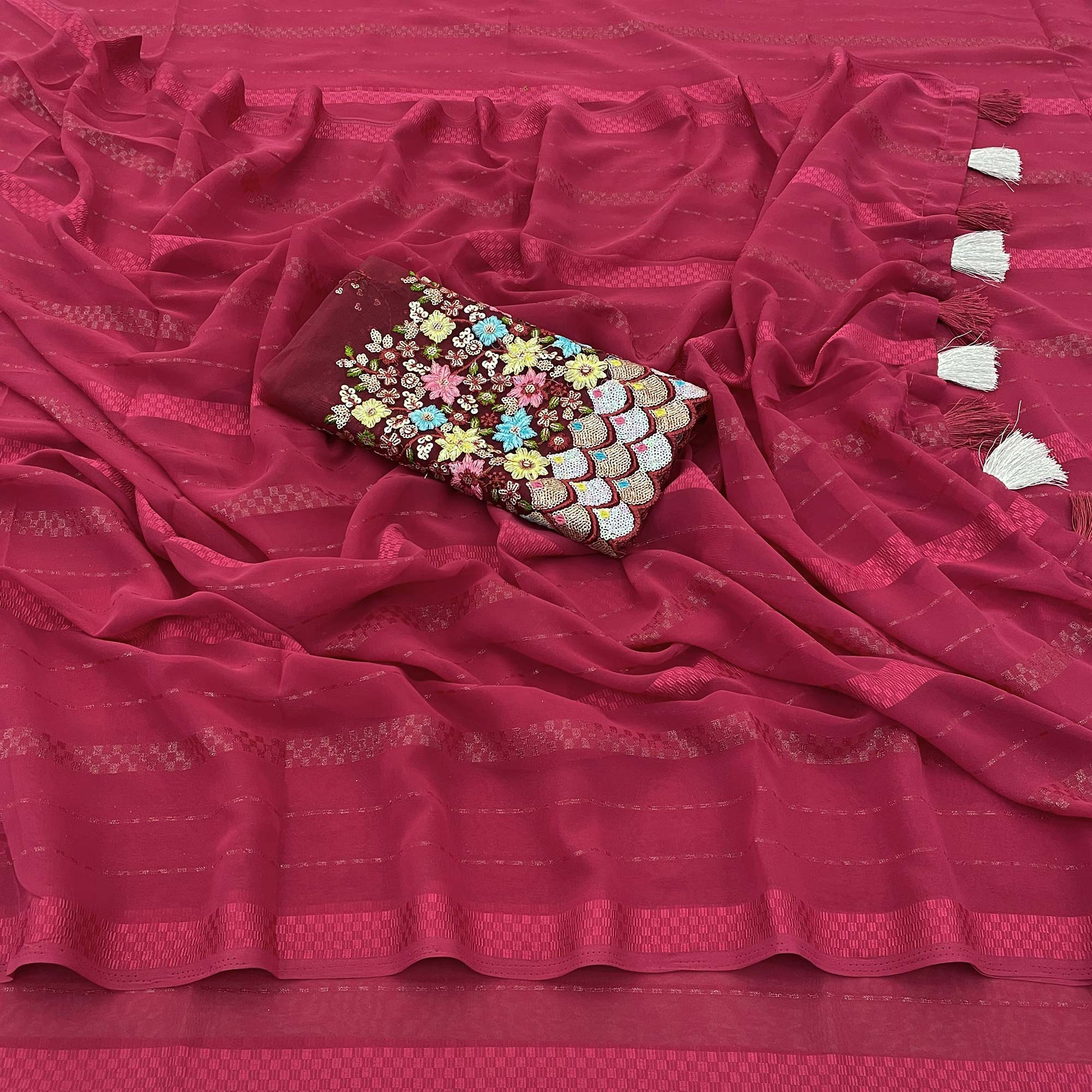 Peachmode Maroon Woven Georgette Saree With Tassels