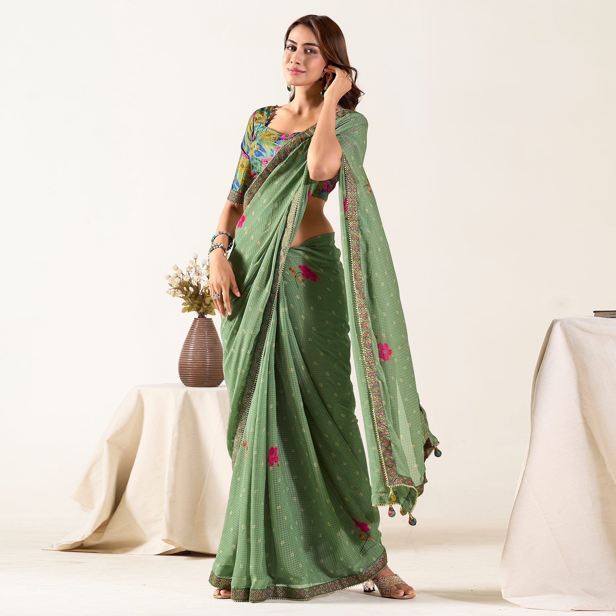 Peachmode Dusty Green Printed With Woven Georgette Saree With Tassels