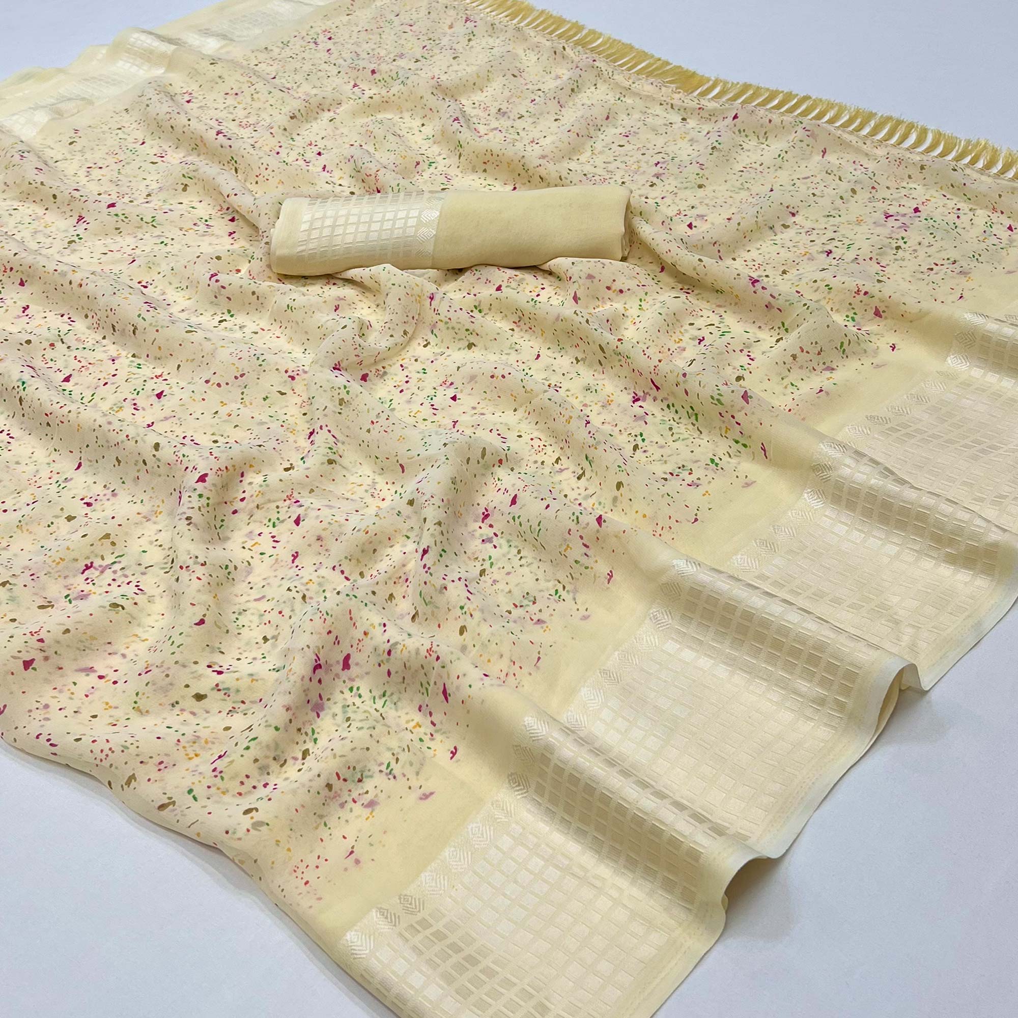 Peachmode Cream Printed Georgette Saree With Tassels