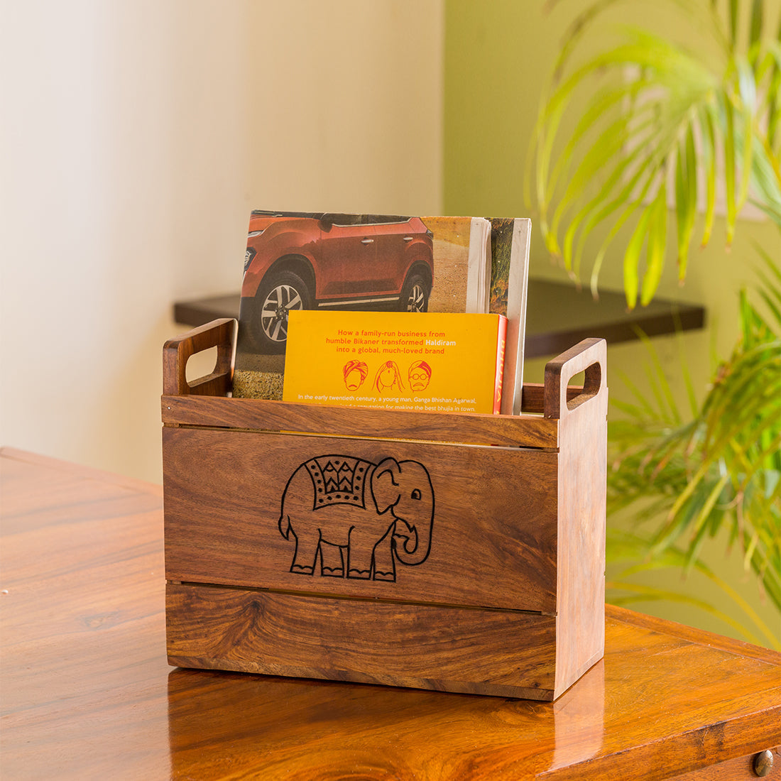 EXCLUSIVELANE 'The Elephant Warriors' Hand Carved Table Magazine Stand In Sheesham Wood
