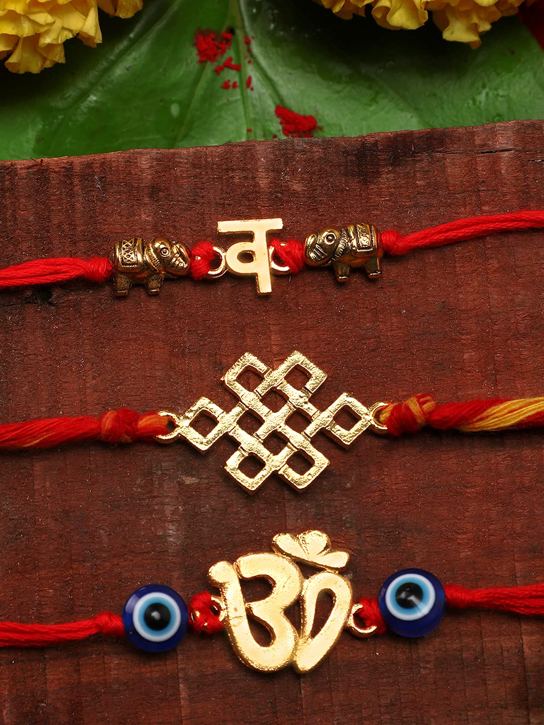 Yellow Chimes Combo of 3 Pcs Handmade Dori Worked Gold Toned OM Initial Letter V and Celtic Design Evil Eye Beads Rakhi for Brother with Roli & Chawal - view 2