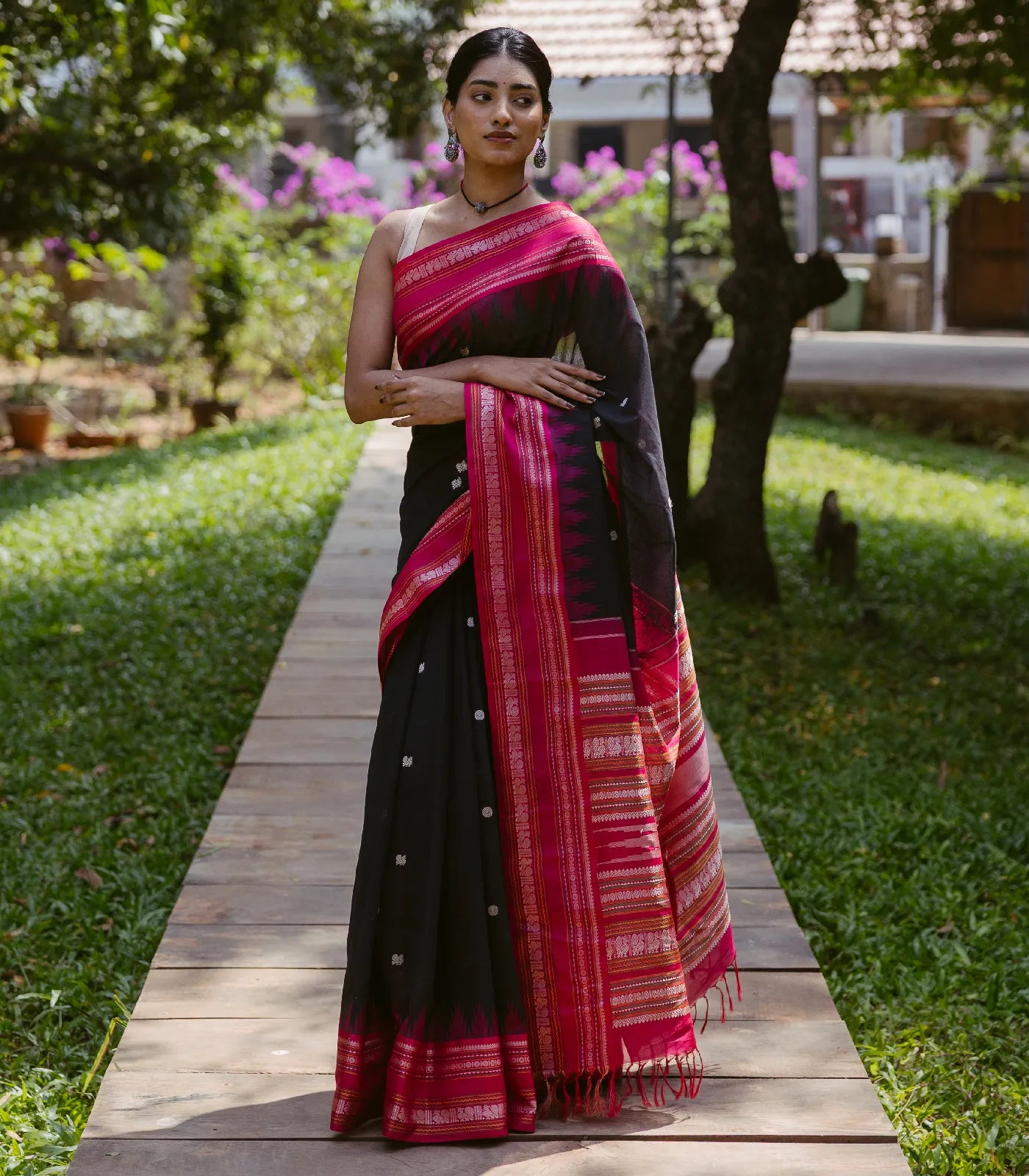 RmKV Black Handloom Korvai Kanchi Cotton Saree With Annam And Rudaksham Motifs in A Pink Border