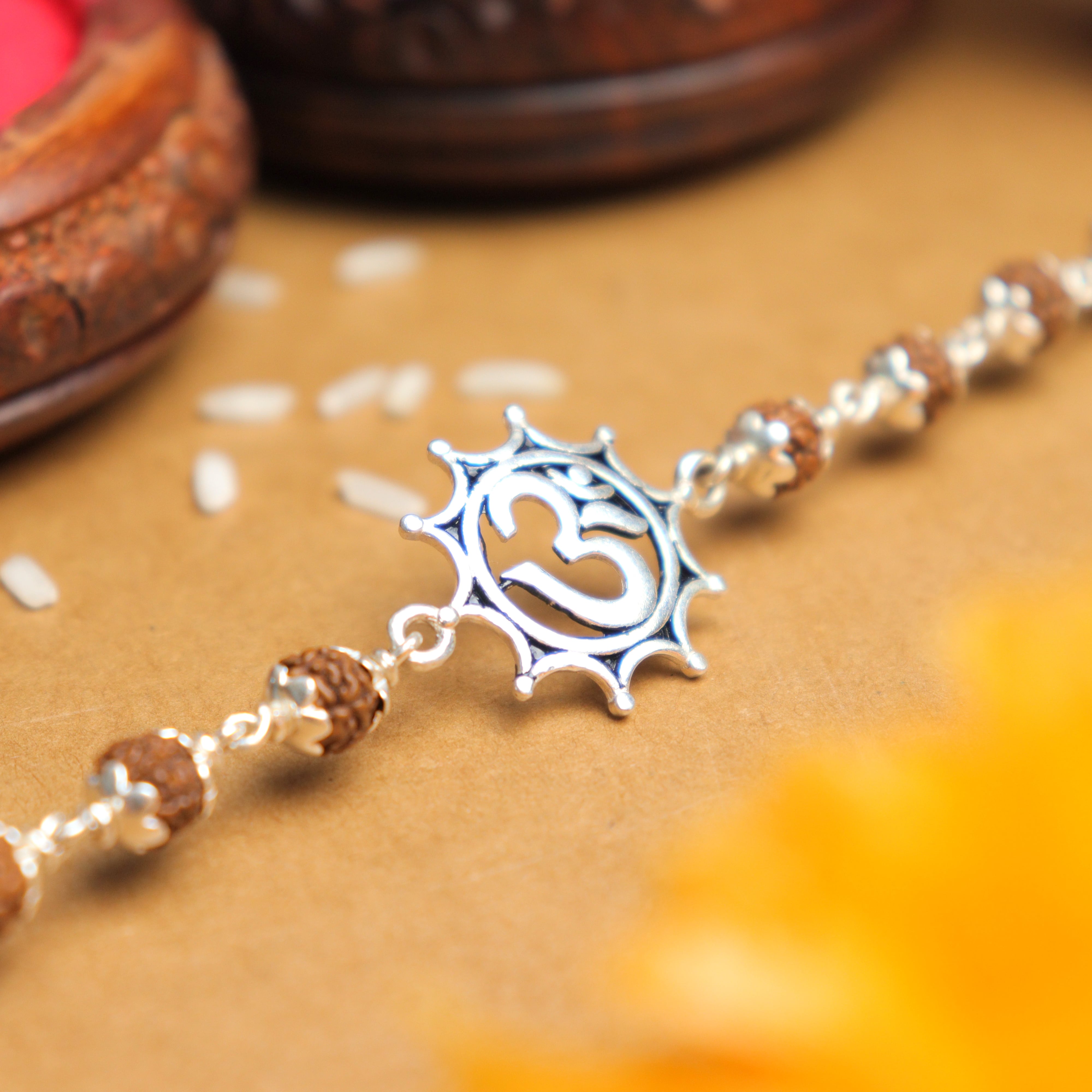 Prinjal Jewellers Silver Rakhi with Om in Pointed Circle and Single Line Rudraksha
