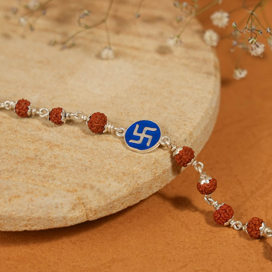 Prinjal Jewellers Rudraksha Silver Bracelet with Blue Swastik Single Line for Kids