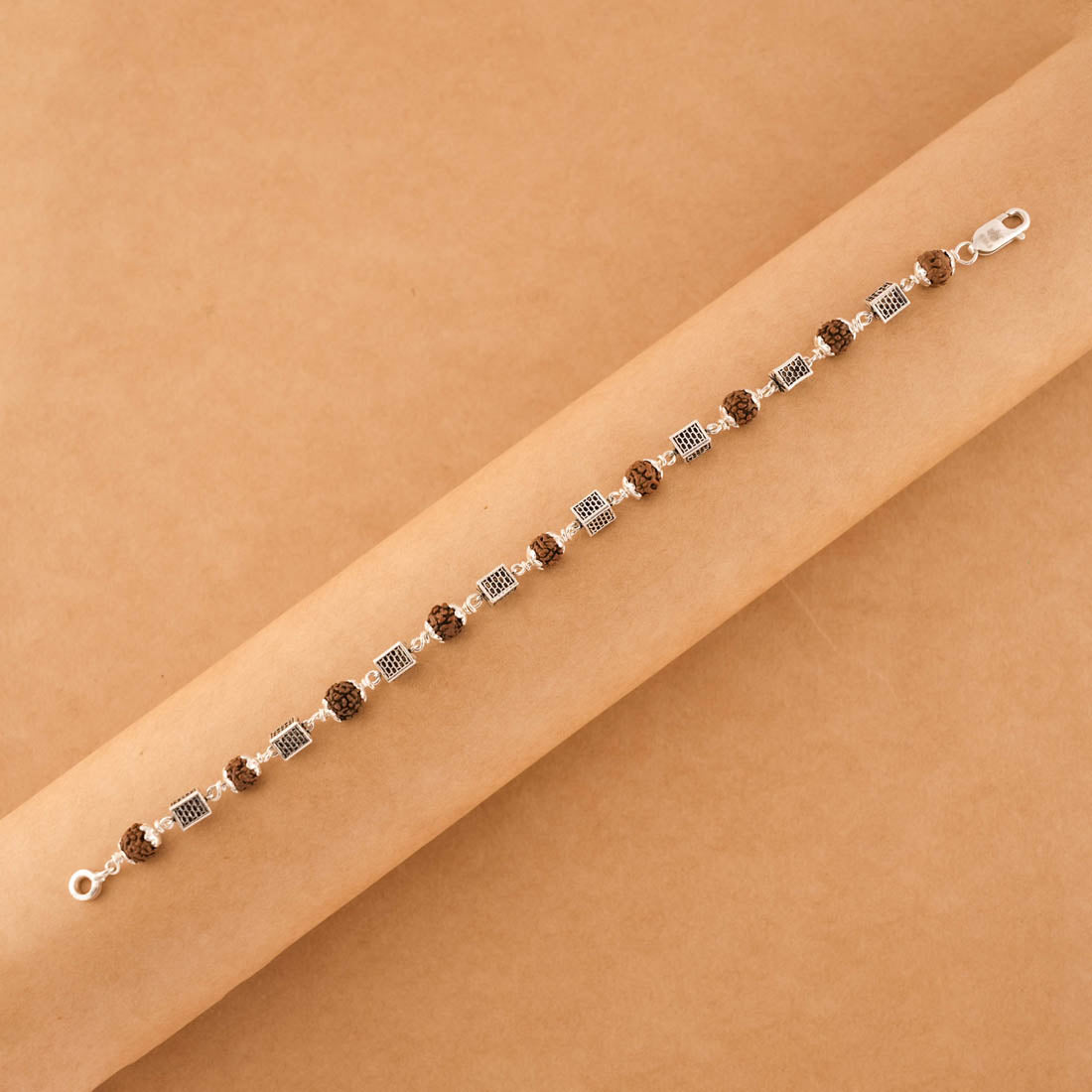 Prinjal Jewellers Silver Rakhi with Square Cylinder Rudraksha Beads - view 4