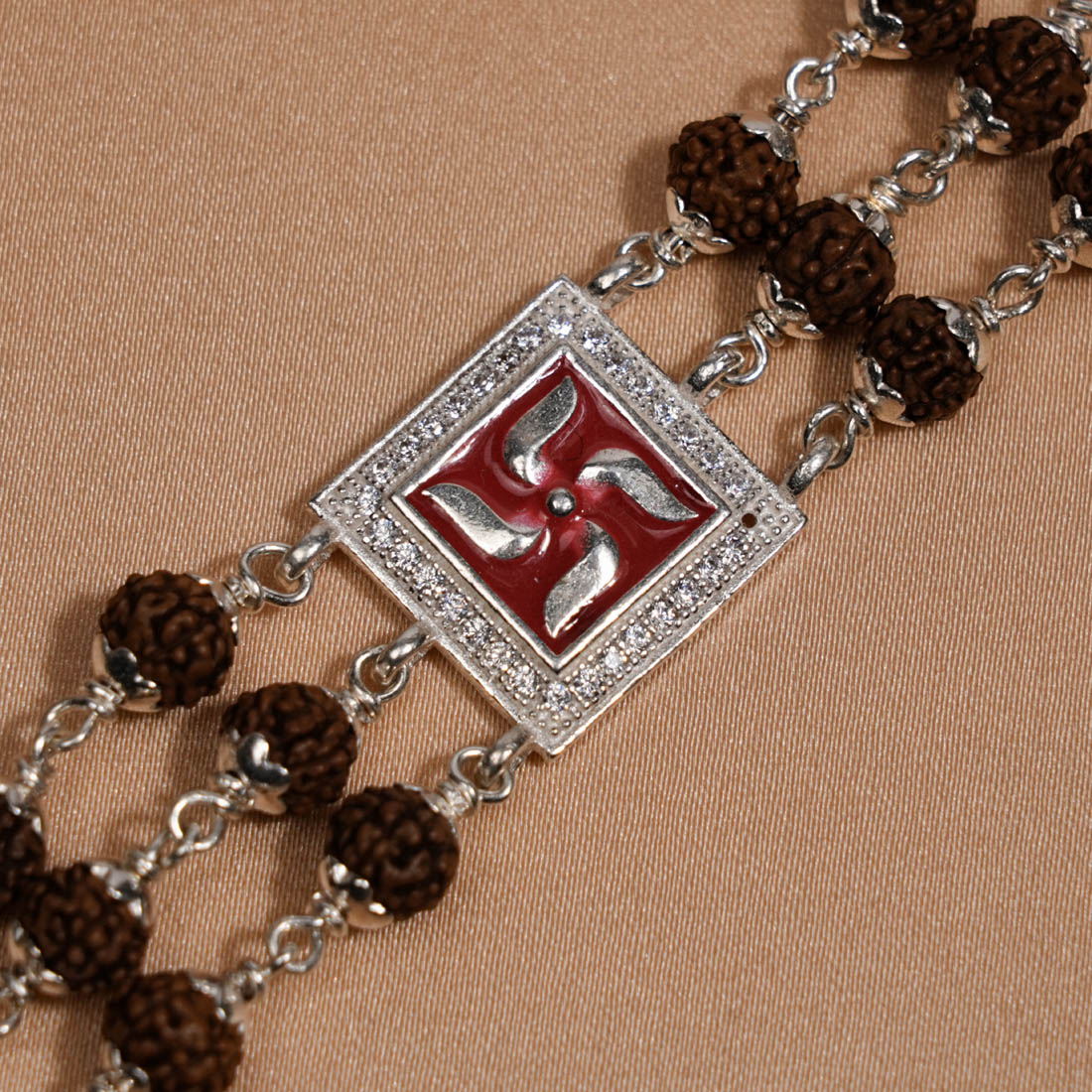 Prinjal Jewellers Rudraksha Silver Swastik in Red Triple Line Bracelet
