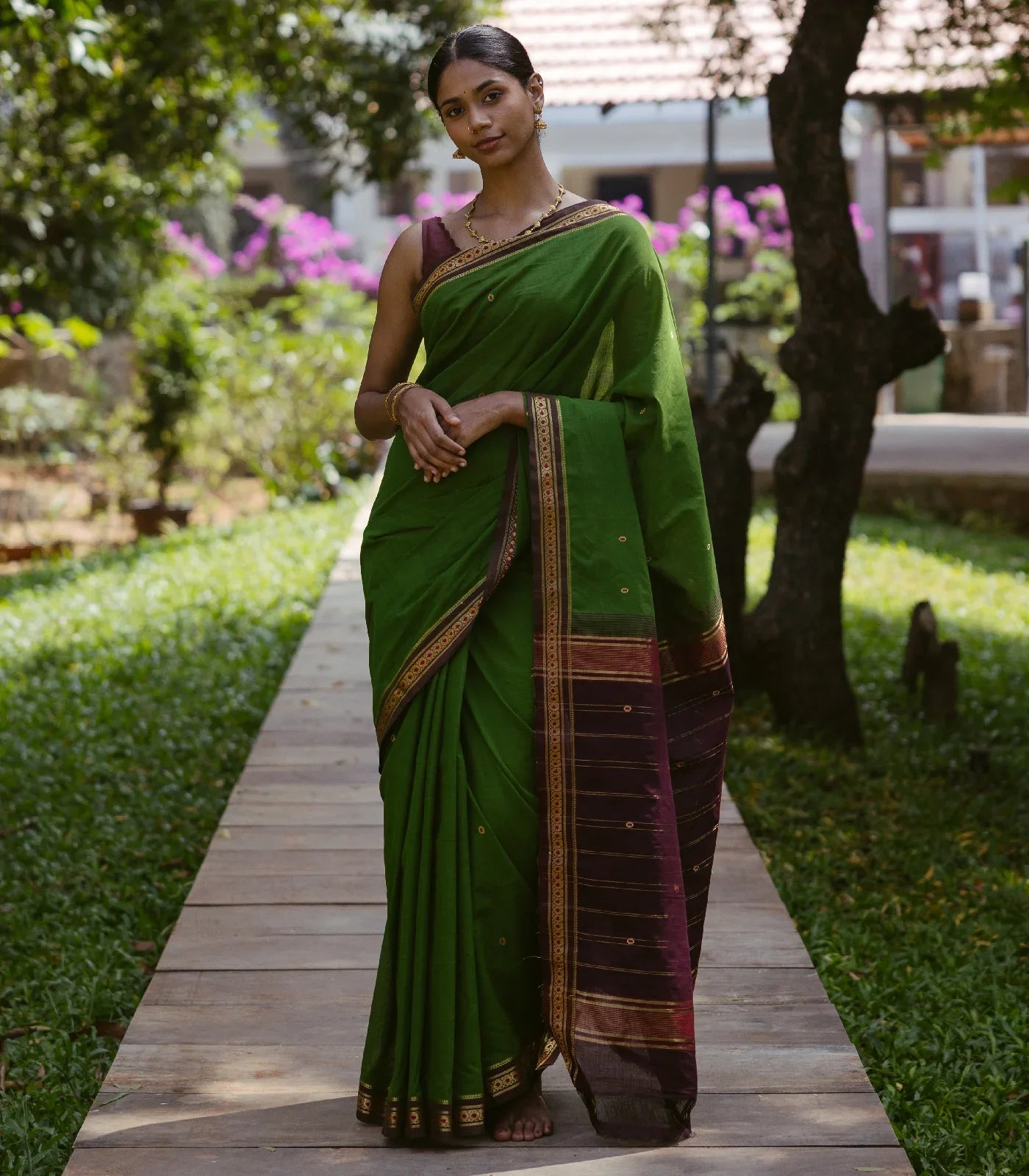 RmKV Green Handloom Kadapa cotton saree adorned with red Meenakari buttis