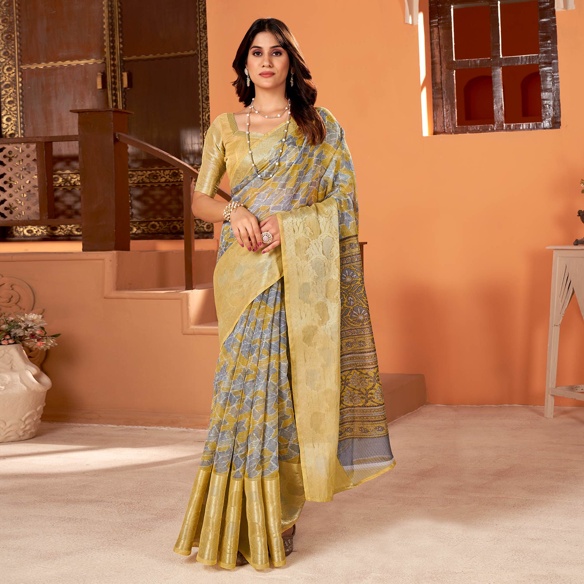 Peachmode Light Mustard Printed Organza Saree With Woven Border