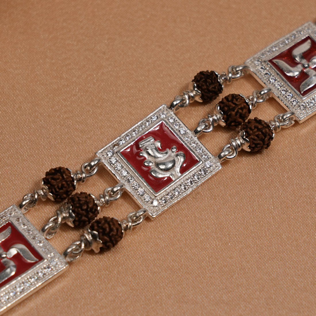 Prinjal Jewellers Rudraksha Silver Ganesh With Swastik Tripal Line Bracelet