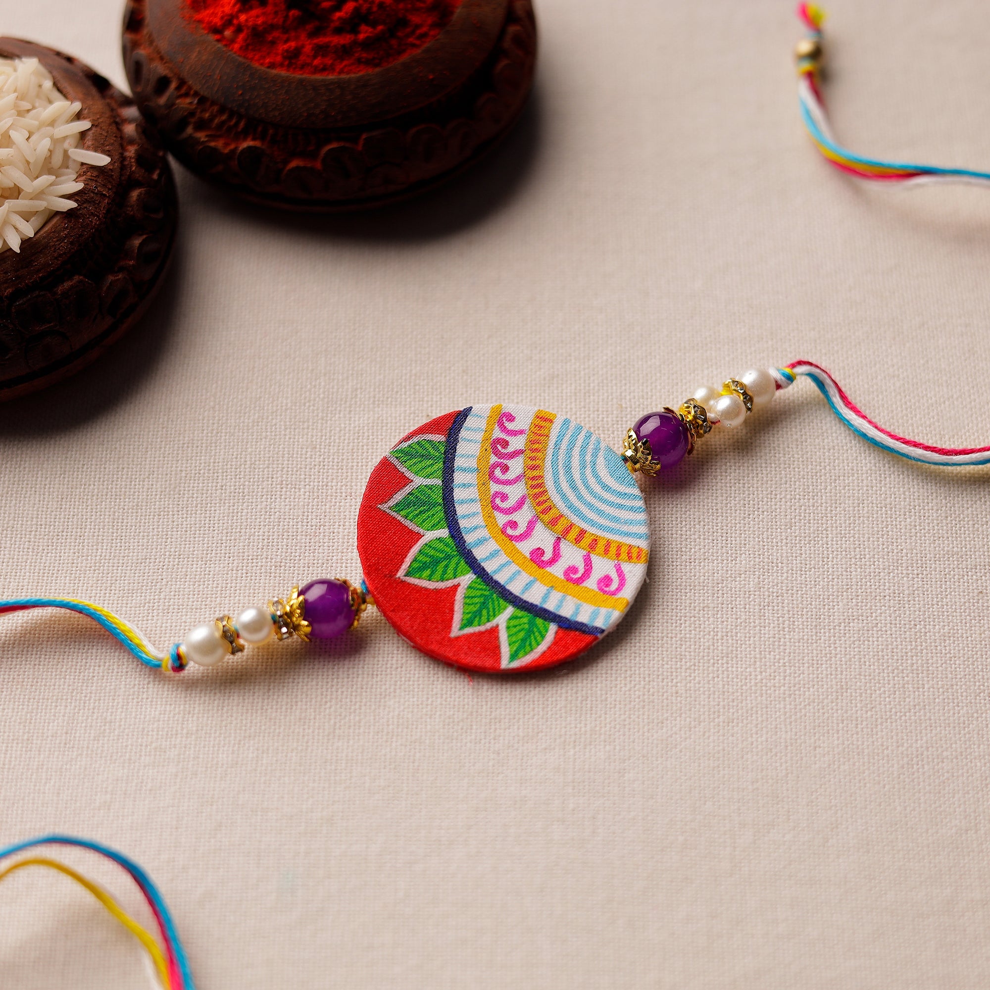 KHUSHBASH - HAPPY LOOM OF EAST Bishnupur Handpainted Fabric Rakhi 17
