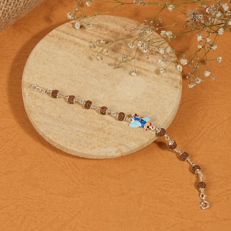 Prinjal Jewellers Rudraksha Silver Bracelet with Colorful Airplane Single Line for Kids - view 2