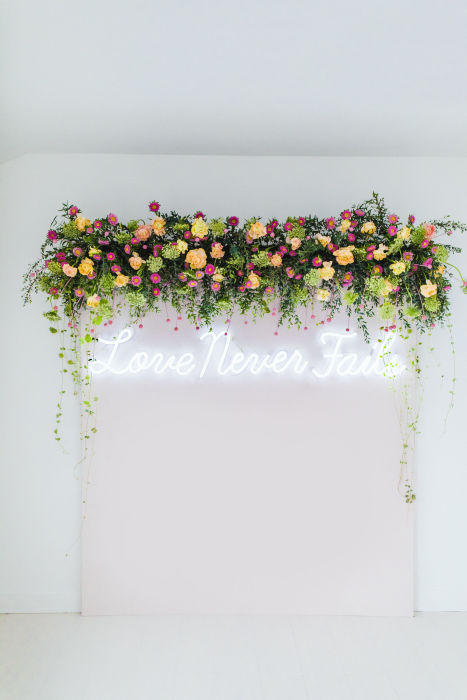 fiftyflowers.com Pops of Pink Floral Backdrop with Wedding Chicks