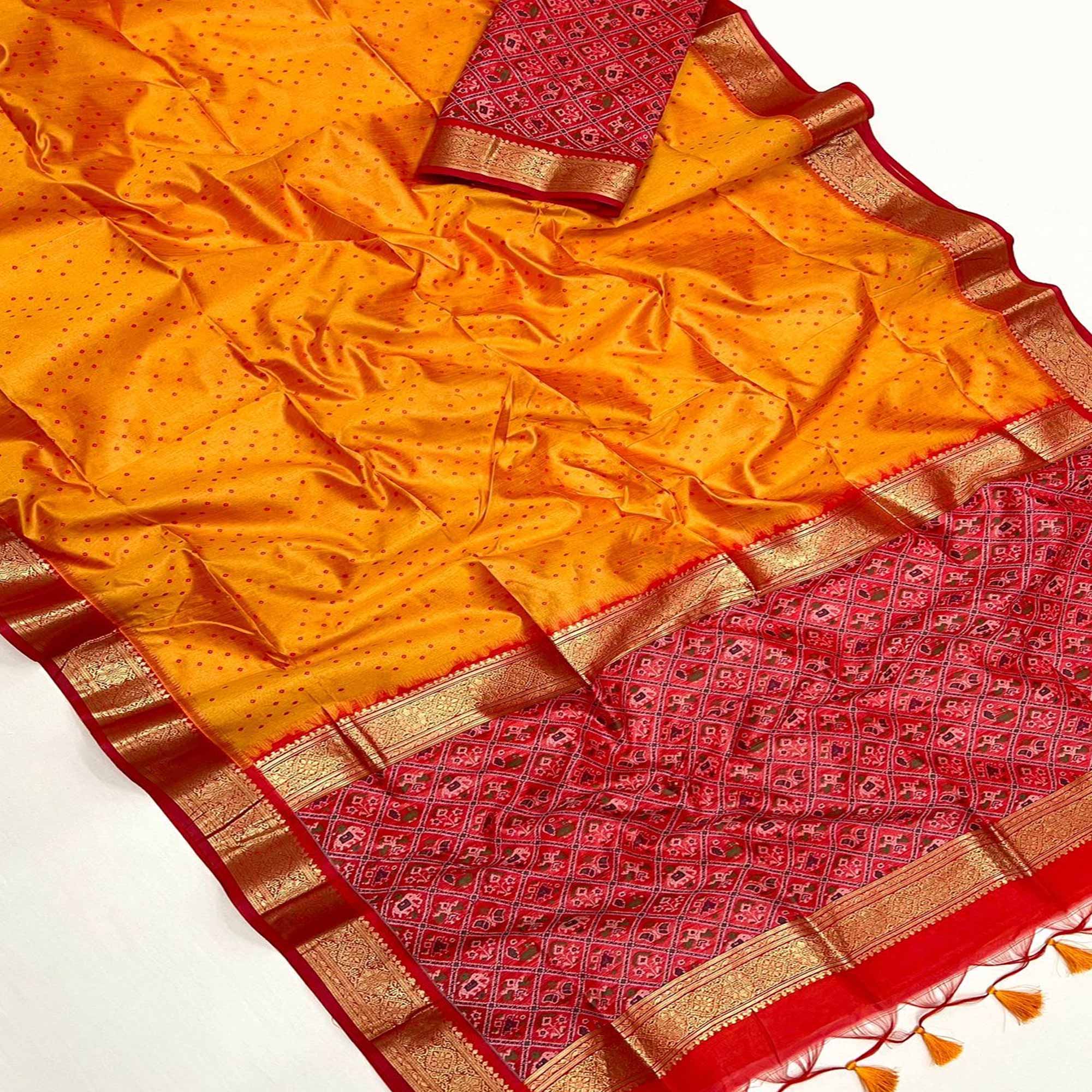 Peachmode Carrot Orange Weaved Patola Tussar Silk Saree With Tassels