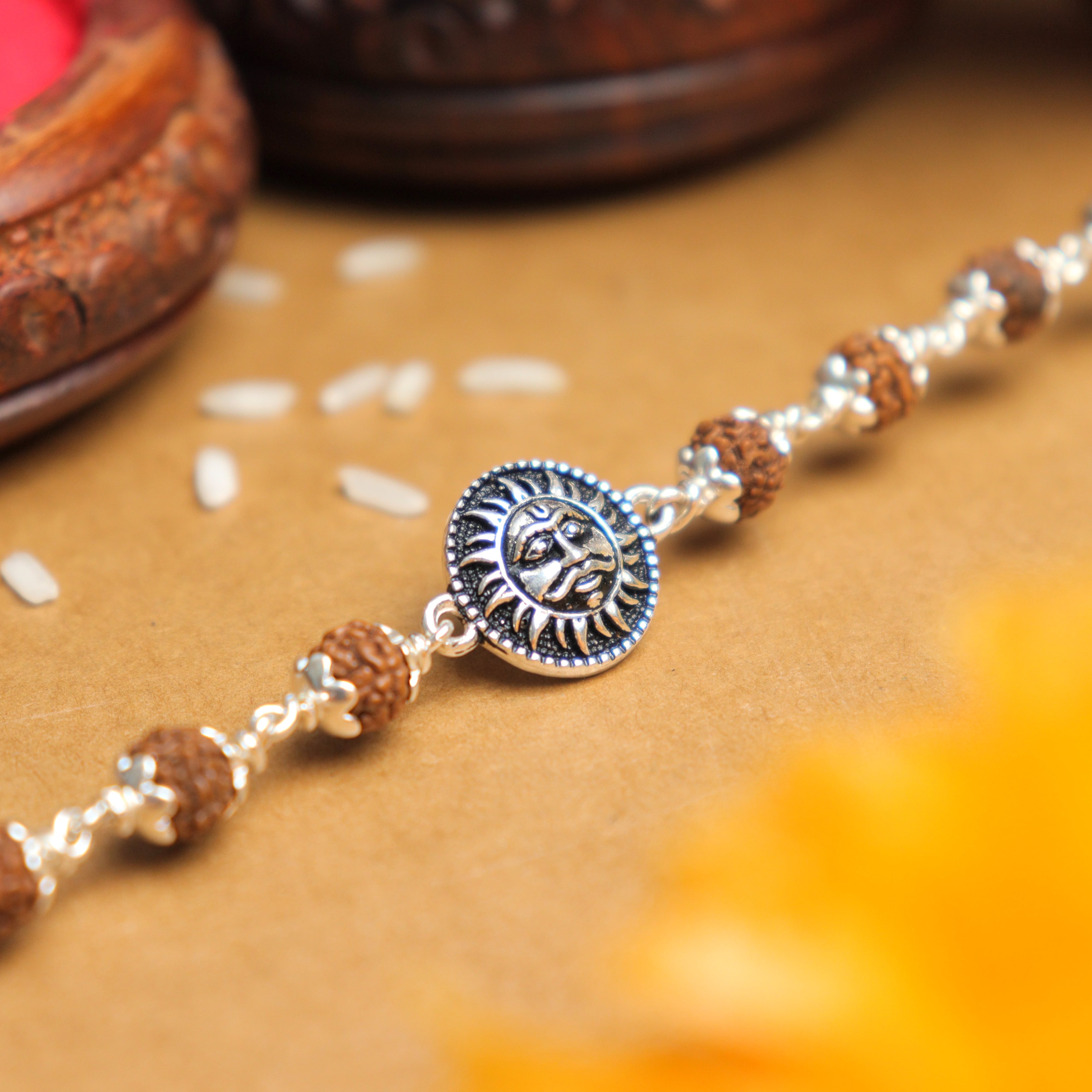 Prinjal Jewellers Silver Rakhi with Suryadev and Rudraksha