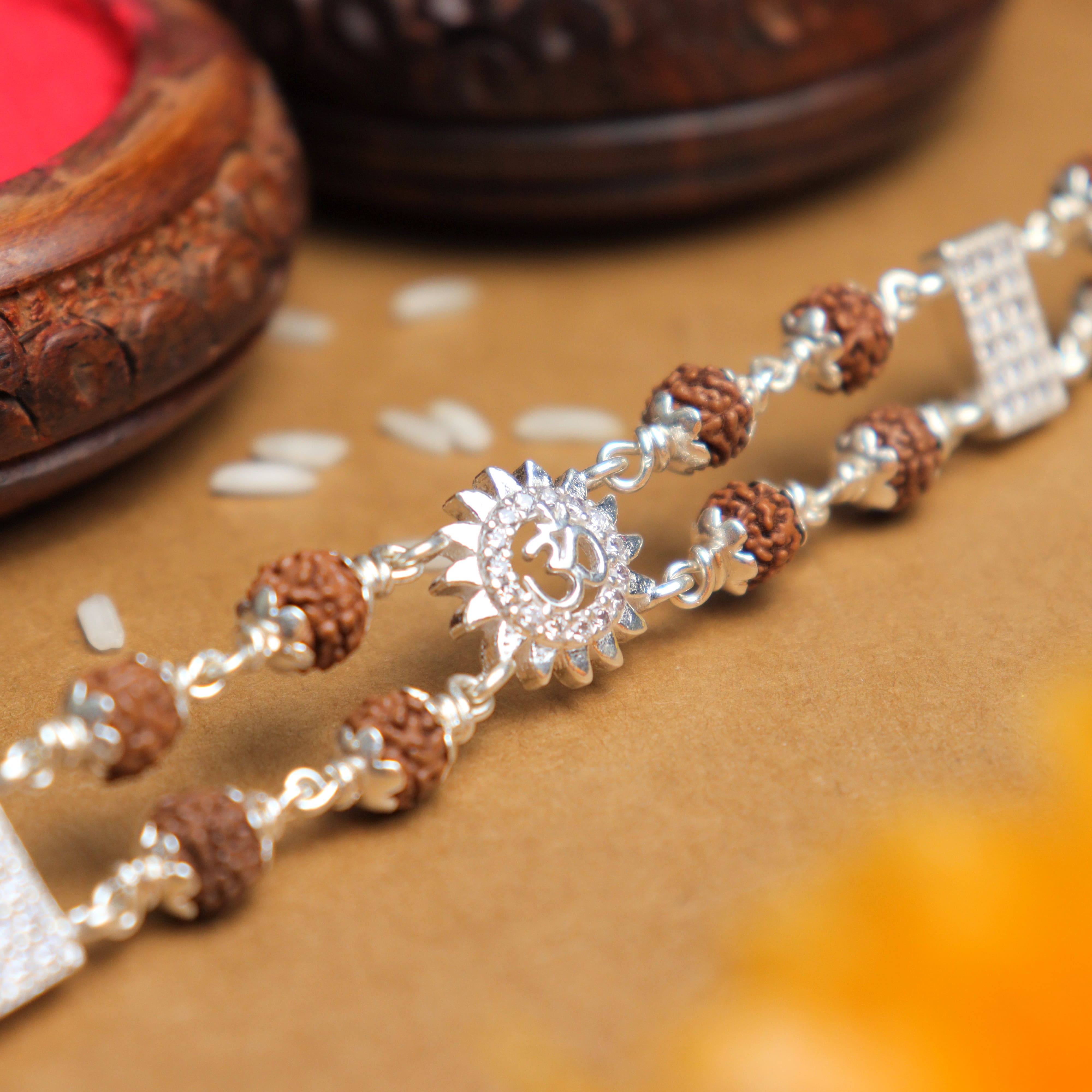 Prinjal Jewellers Silver Rakhi with Rudraksha, Om Flower Brooch, Double Line Bracelet
