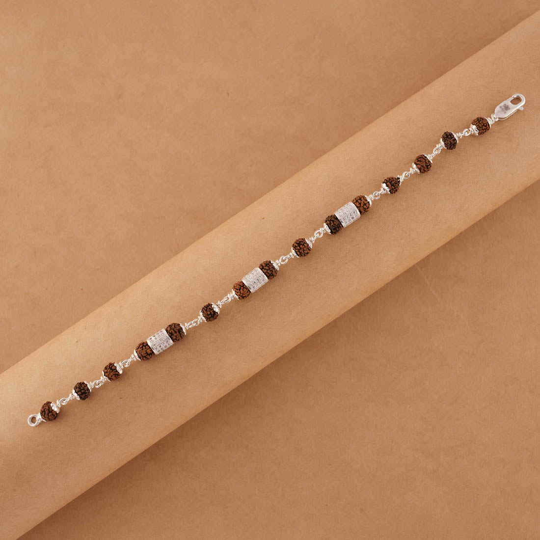 Prinjal Jewellers Silver Rakhi with Rudraksha and Three Diamond Cylinders - view 4