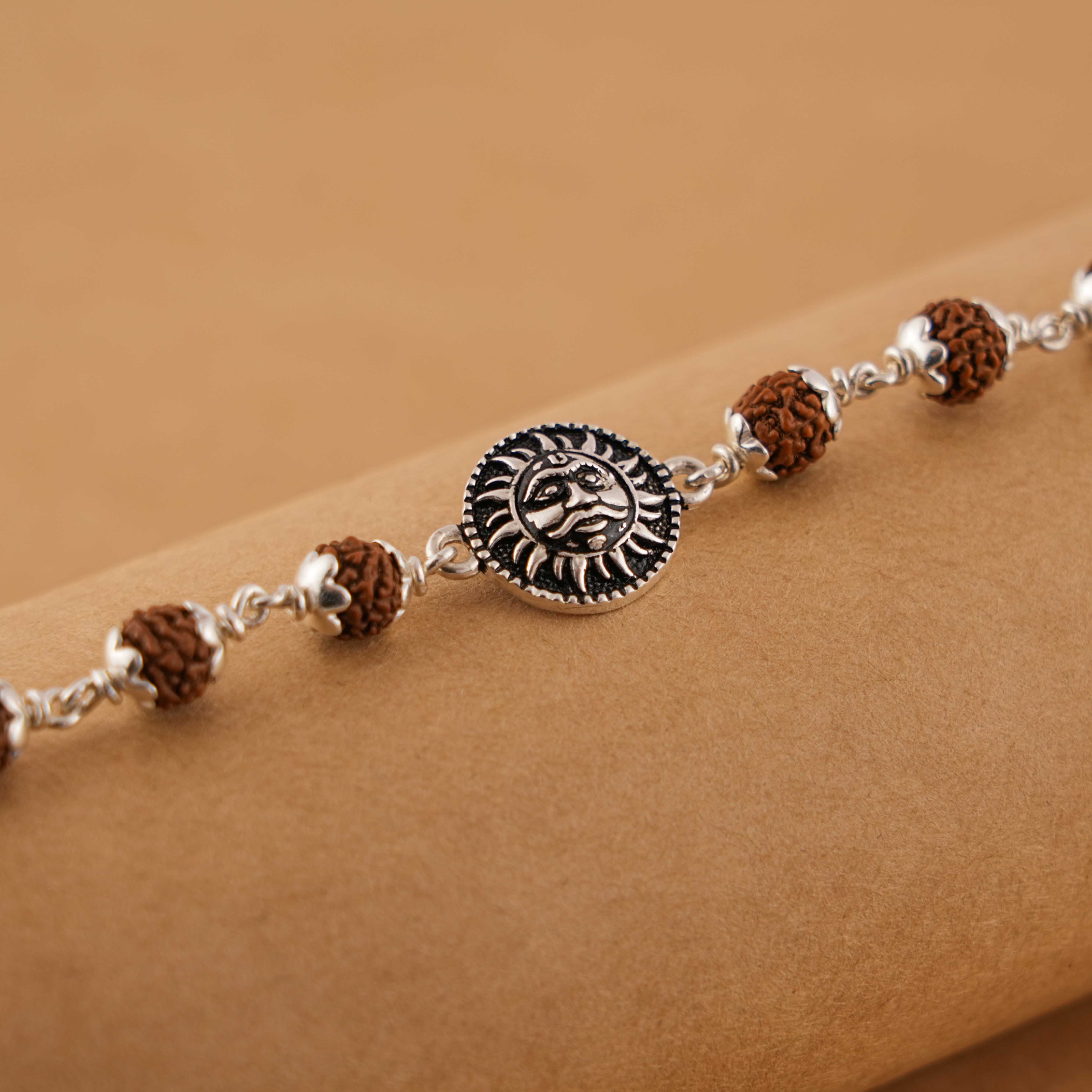 Prinjal Jewellers Silver Rakhi with Suryadev and Rudraksha - view 3