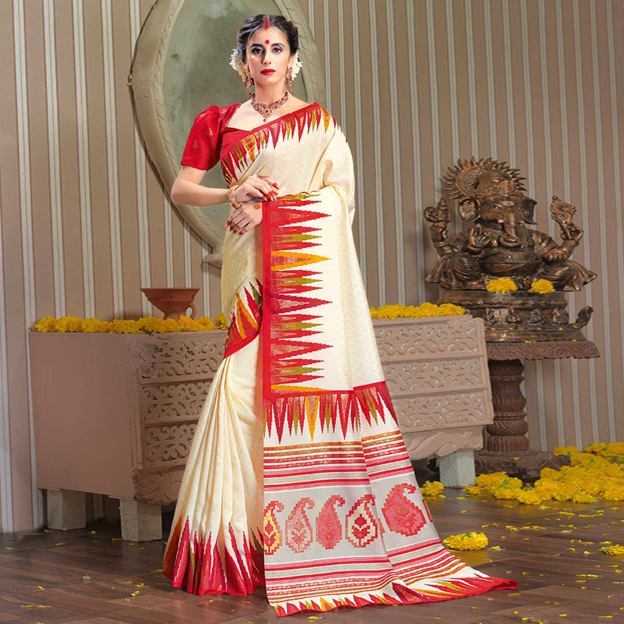 Peachmode Majesty Cream Colored Festive Wear Patola Silk saree