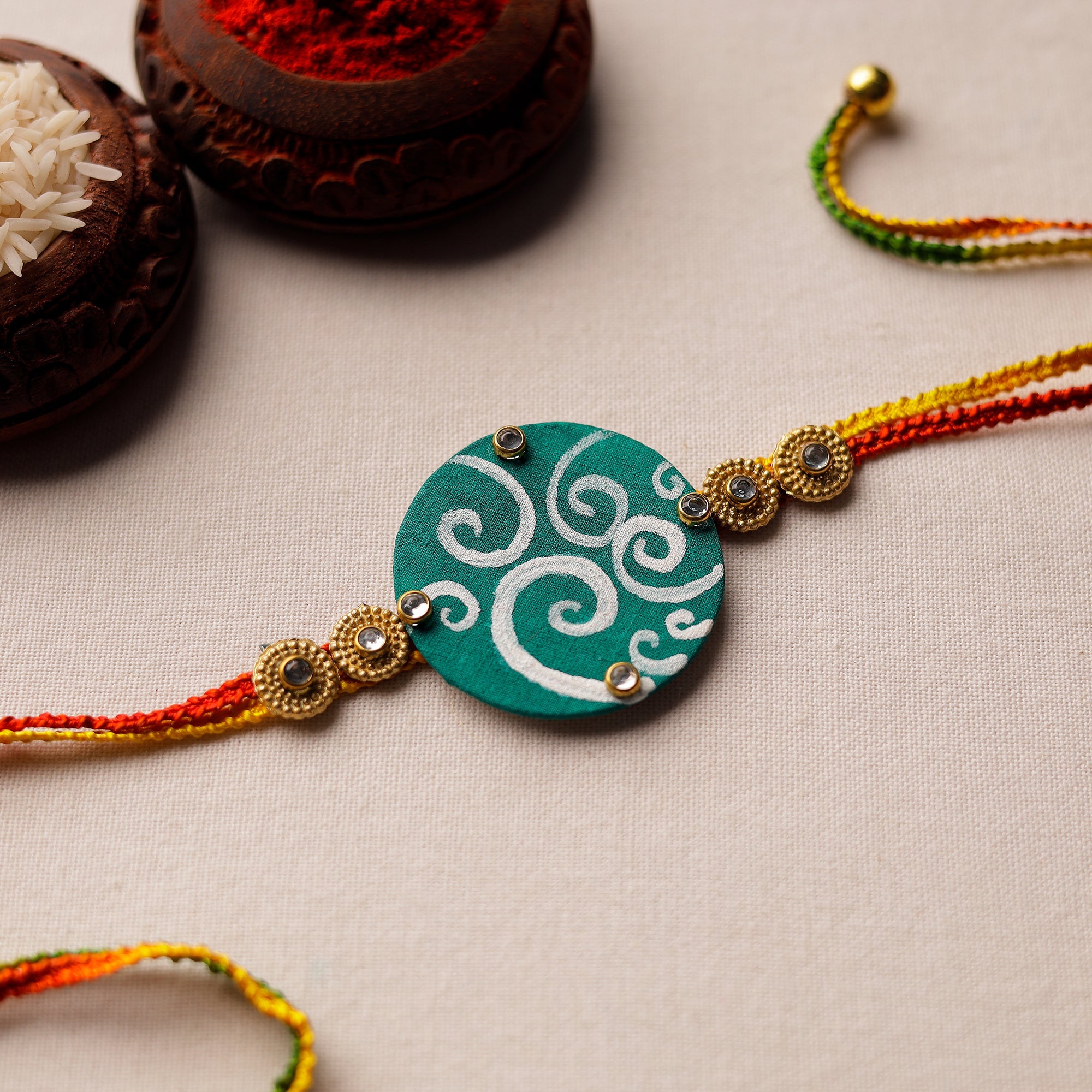 KHUSHBASH - HAPPY LOOM OF EAST Bishnupur Handpainted Fabric Rakhi 12