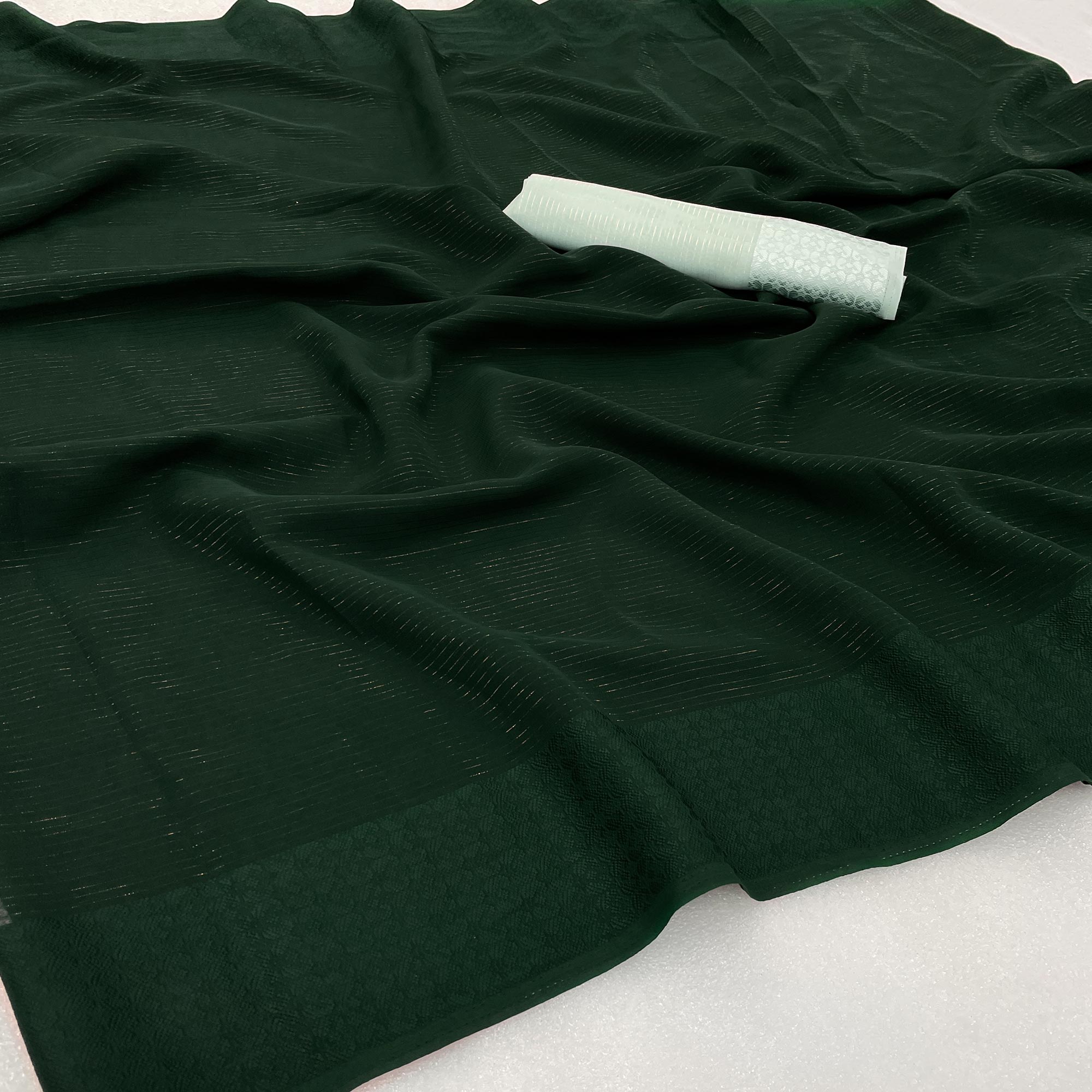 Peachmode Bottle Green Zari Woven Georgette Saree
