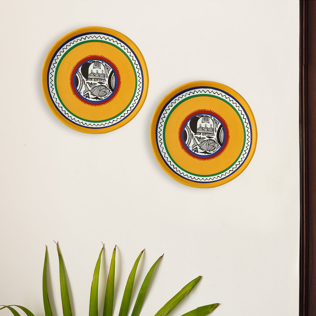 EXCLUSIVELANE 'The Madhubani Tales' Hand Painted Terracotta Wall Plates Wall Décor (8 inch, Set of 2, Yellow)