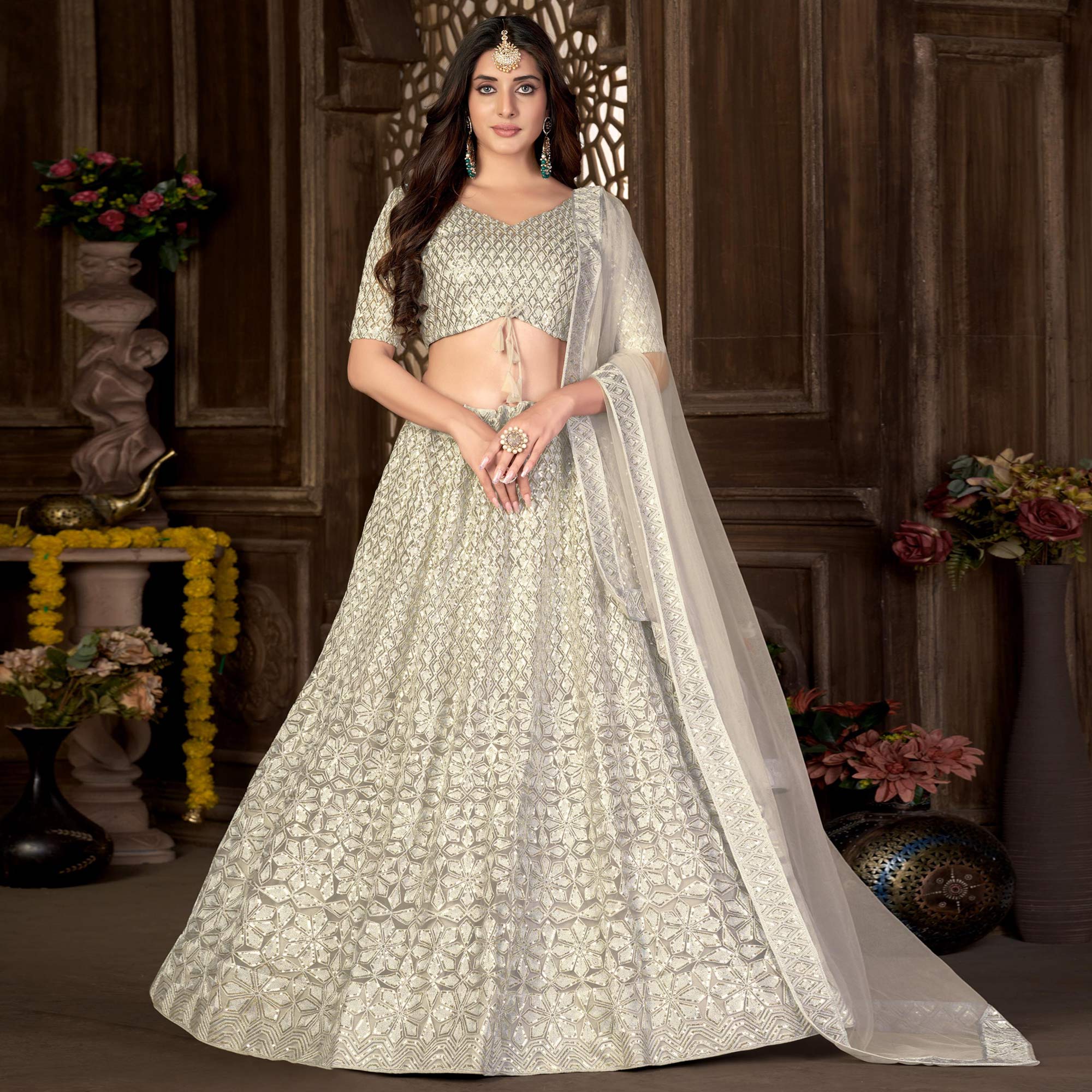 Peachmode Cream Sequins Embroidered Net Lehenga Choli