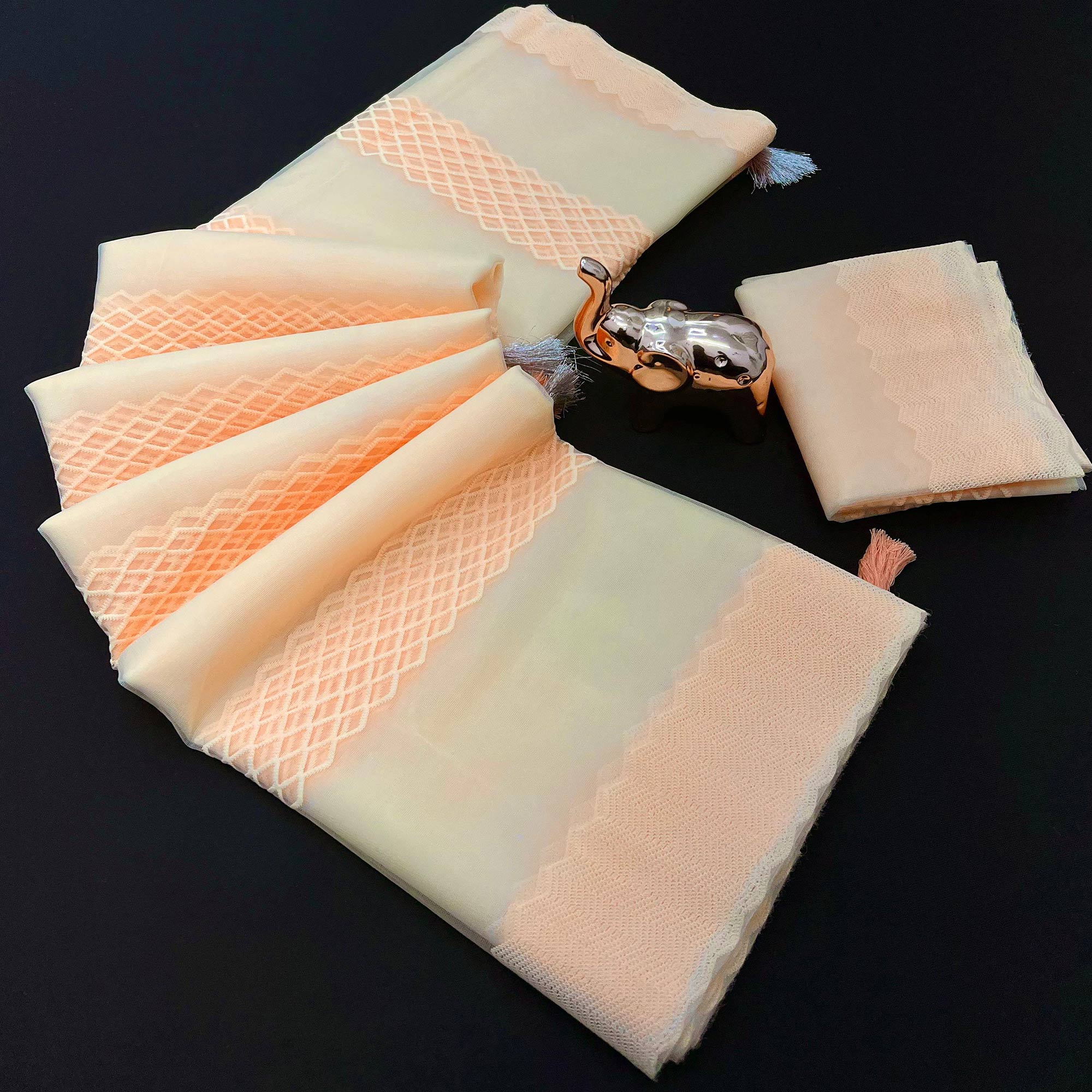 Peachmode Light Peach Woven Thread Work Net Saree With Tassels