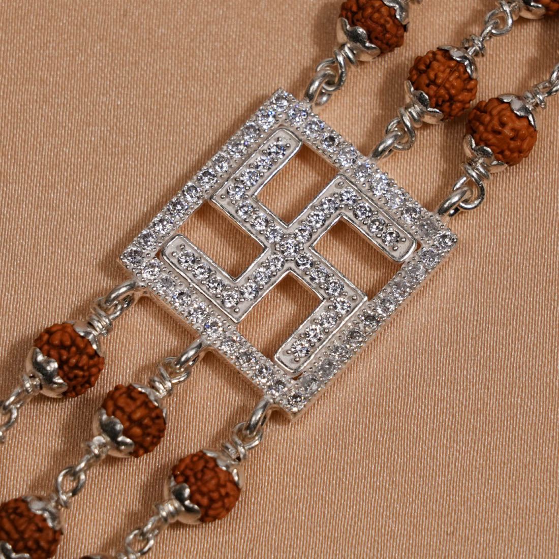Prinjal Jewellers Rudraksha Silver Swastik Brooch Triple Line Bracelet