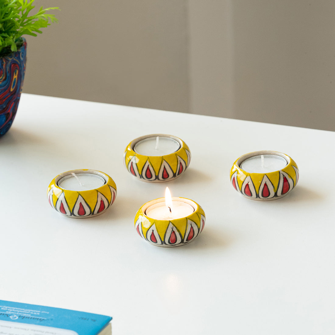 EXCLUSIVELANE 'Mughal Flaming Jugnu' Handpainted Tea Light Holder (Set of 4, Ceramic)