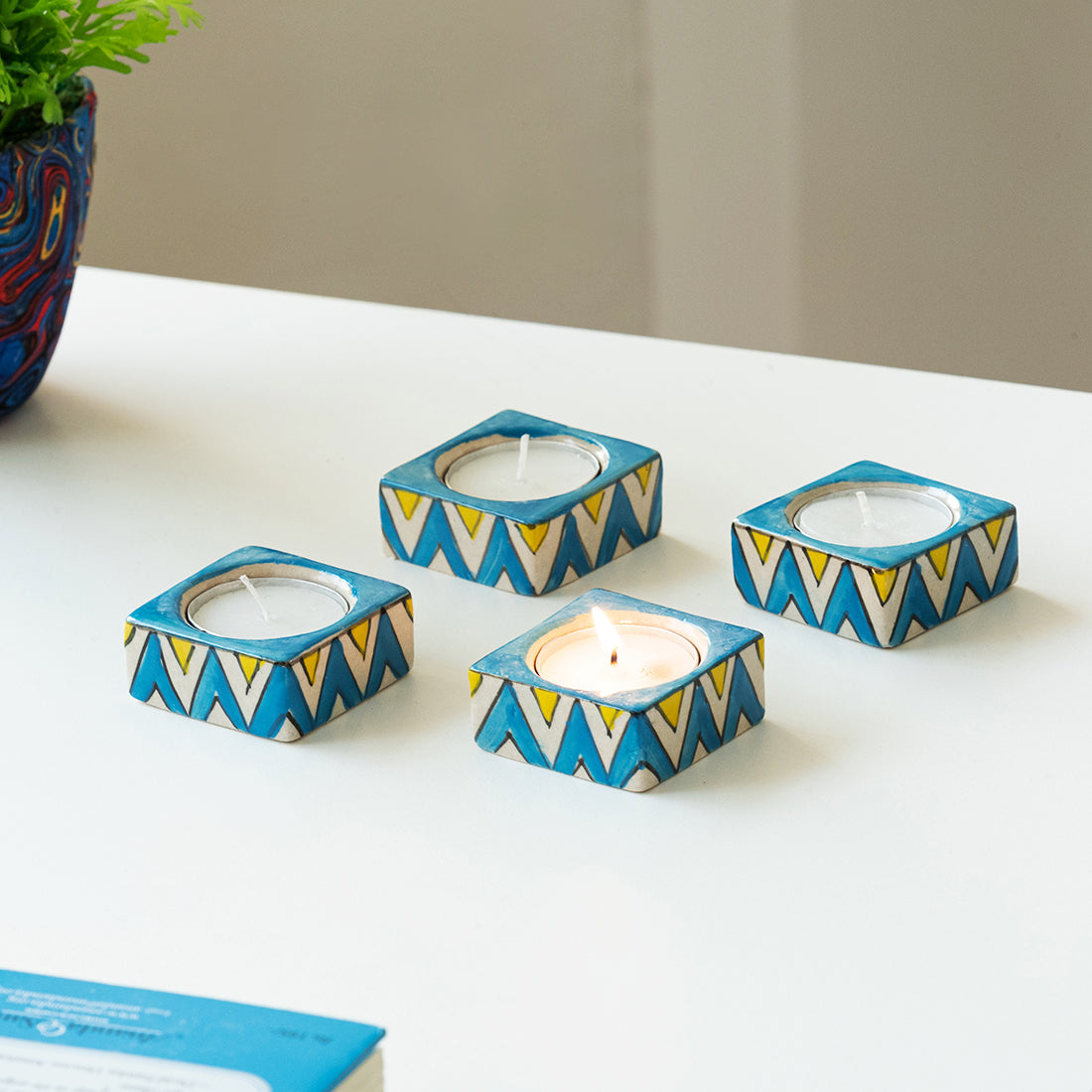 EXCLUSIVELANE 'Mughal Zig-Zag Jugnu' Handpainted Tea Light Holder (Set of 4, Ceramic)