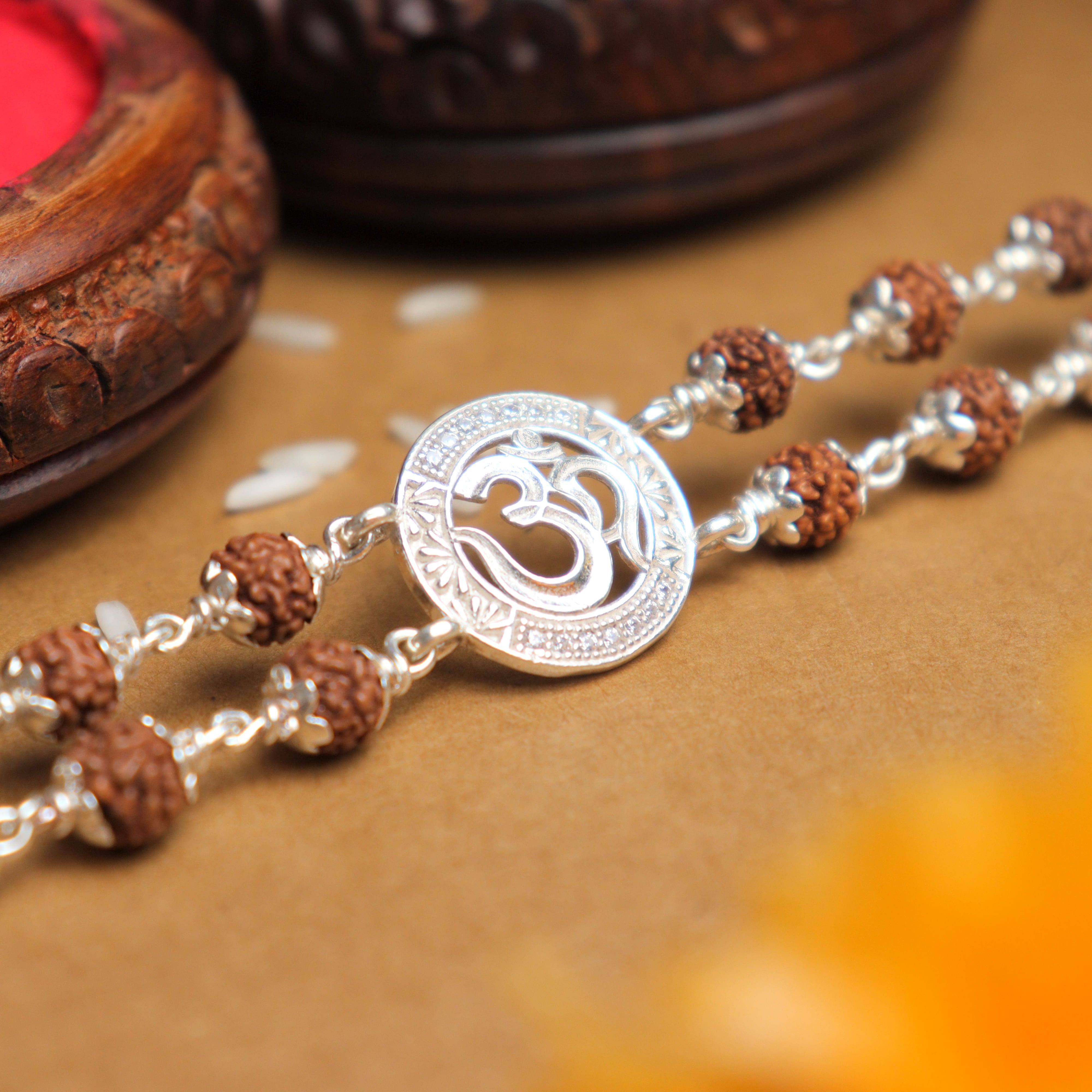 Prinjal Jewellers Silver Rakhi with Rudraksha and Om in the Middle, Double Line Design