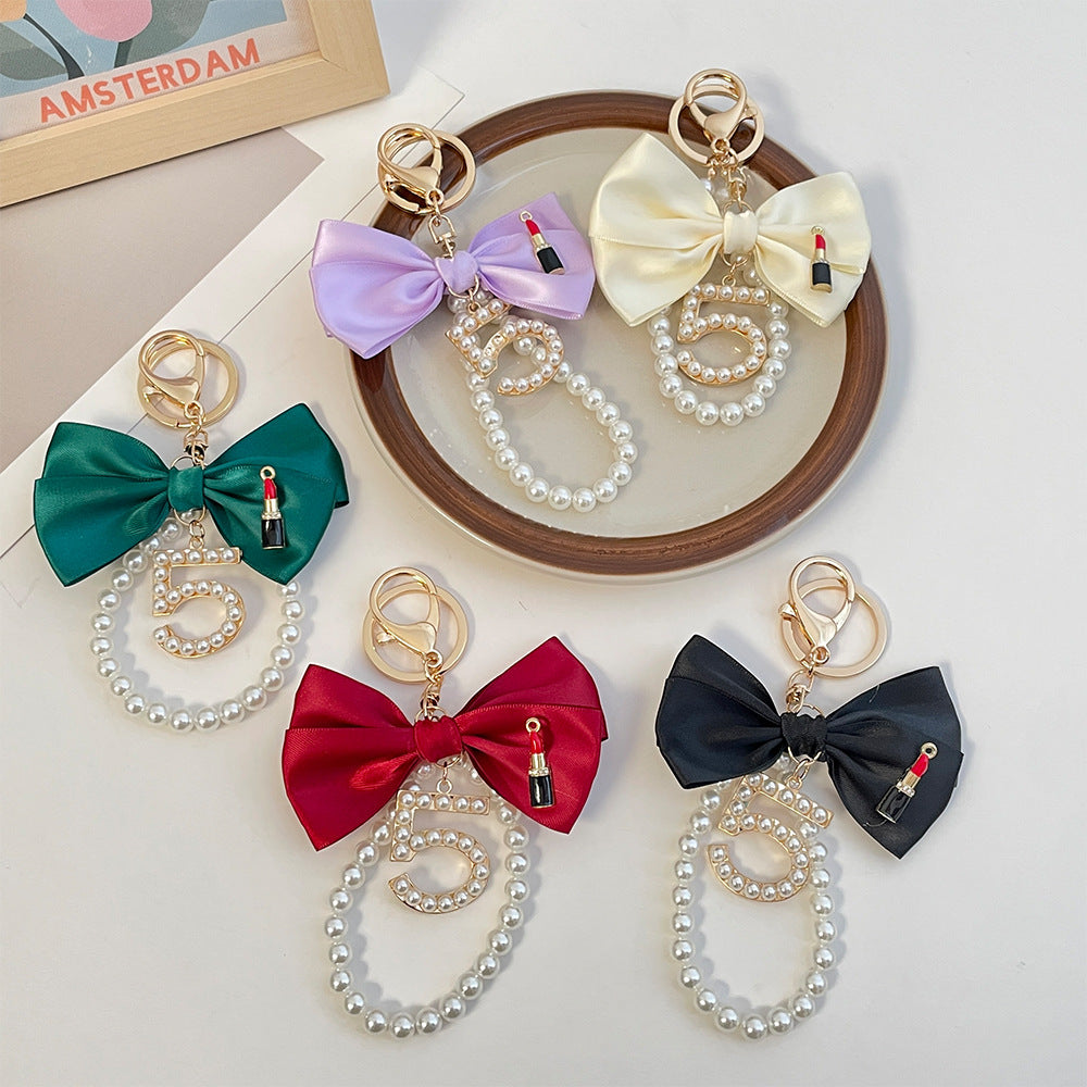 Peeperly Graceful Pearl String Bow Keychain
