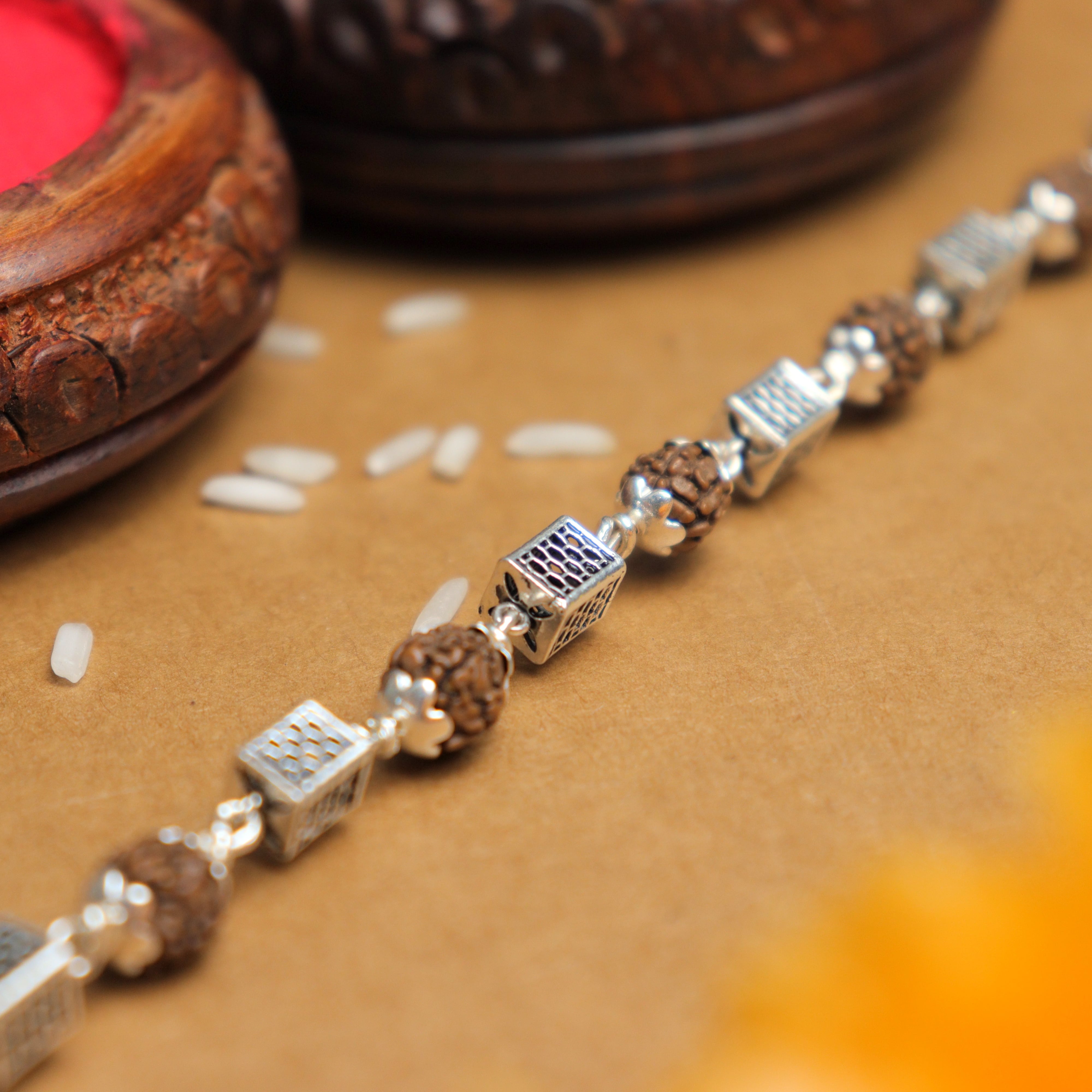 Prinjal Jewellers Silver Rakhi with Square Cylinder Rudraksha Beads