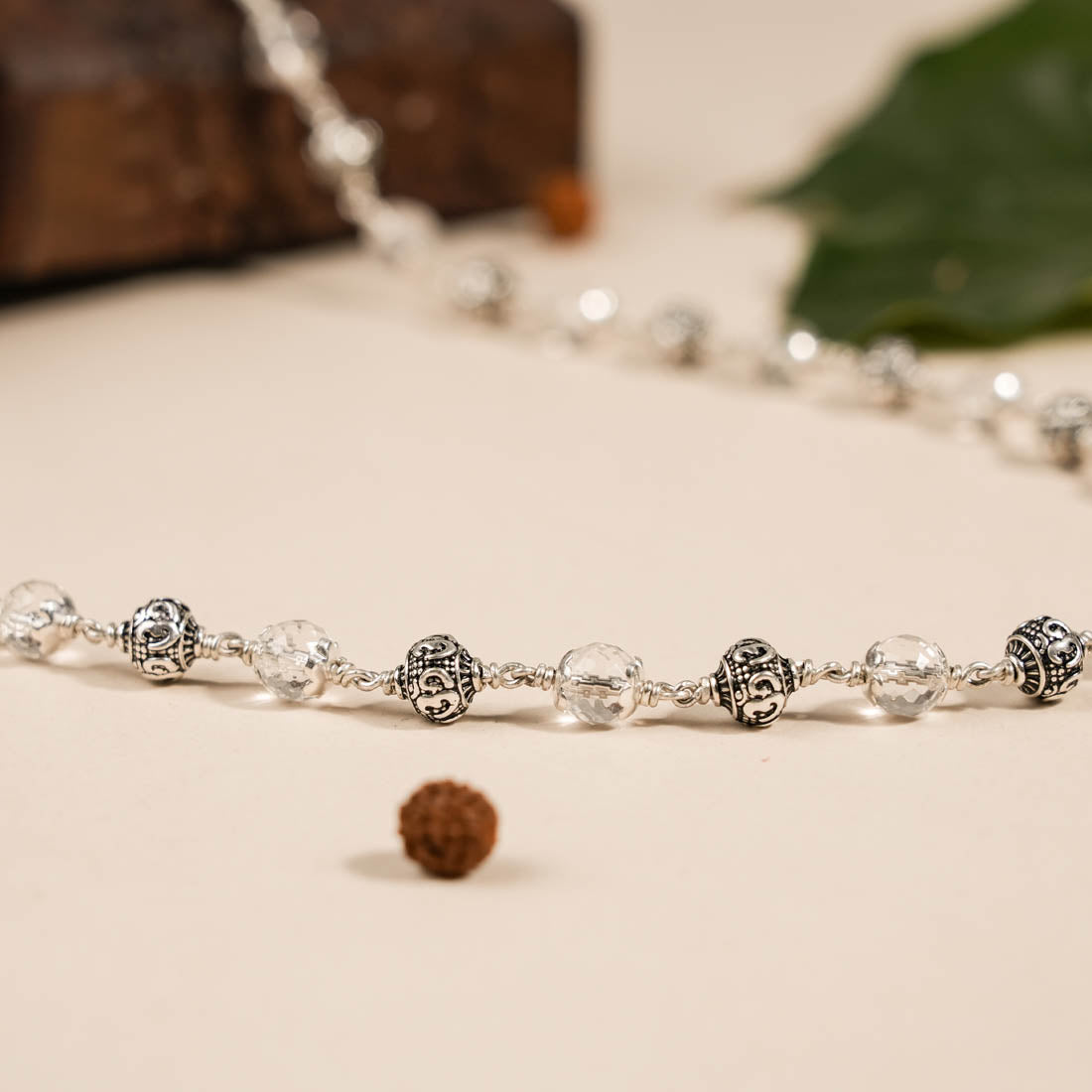Prinjal Jewellers Sphatik Diamond Cut Beads With Om Silver Beads Mala