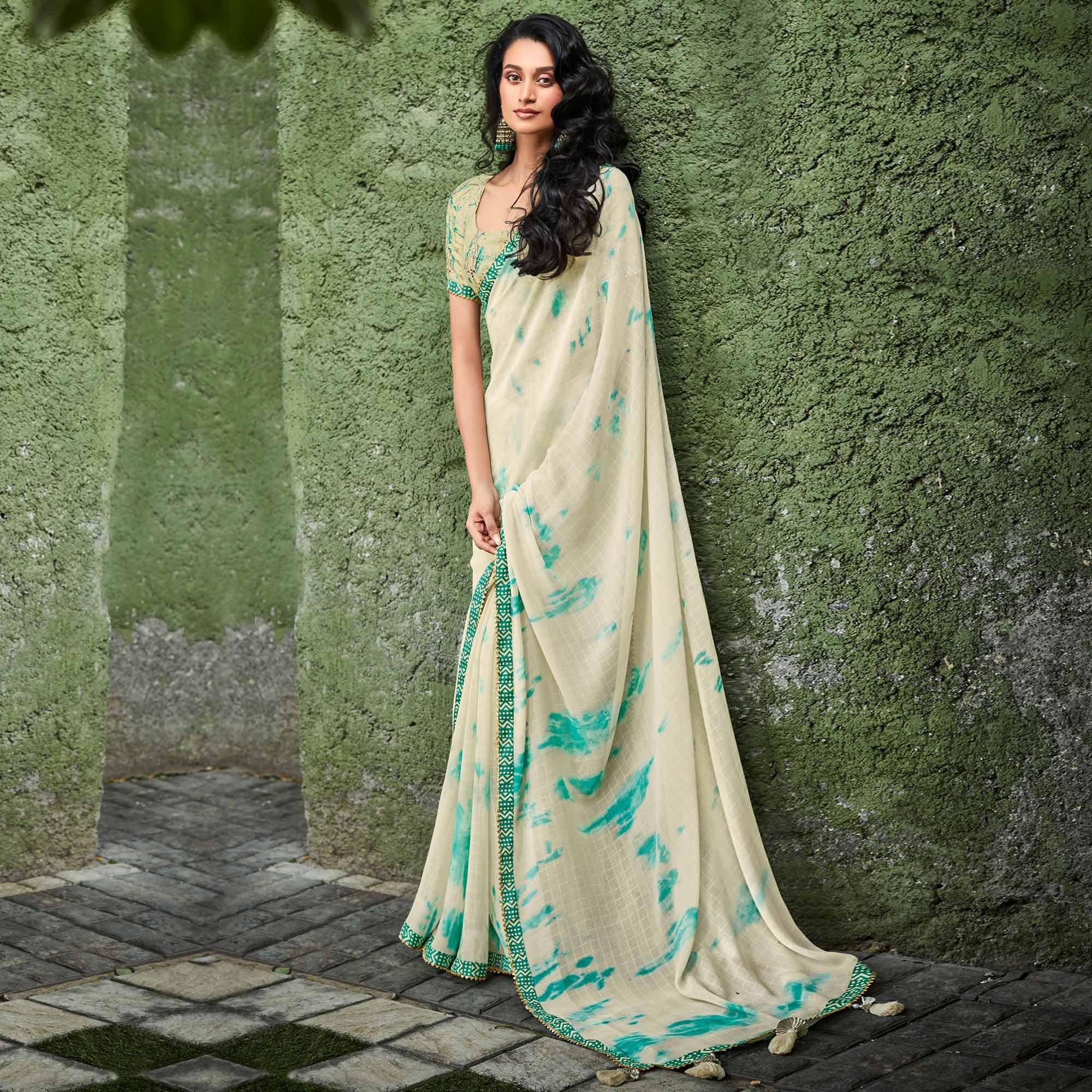 Peachmode Cream Printed With Gota Patti Border Georgette Saree