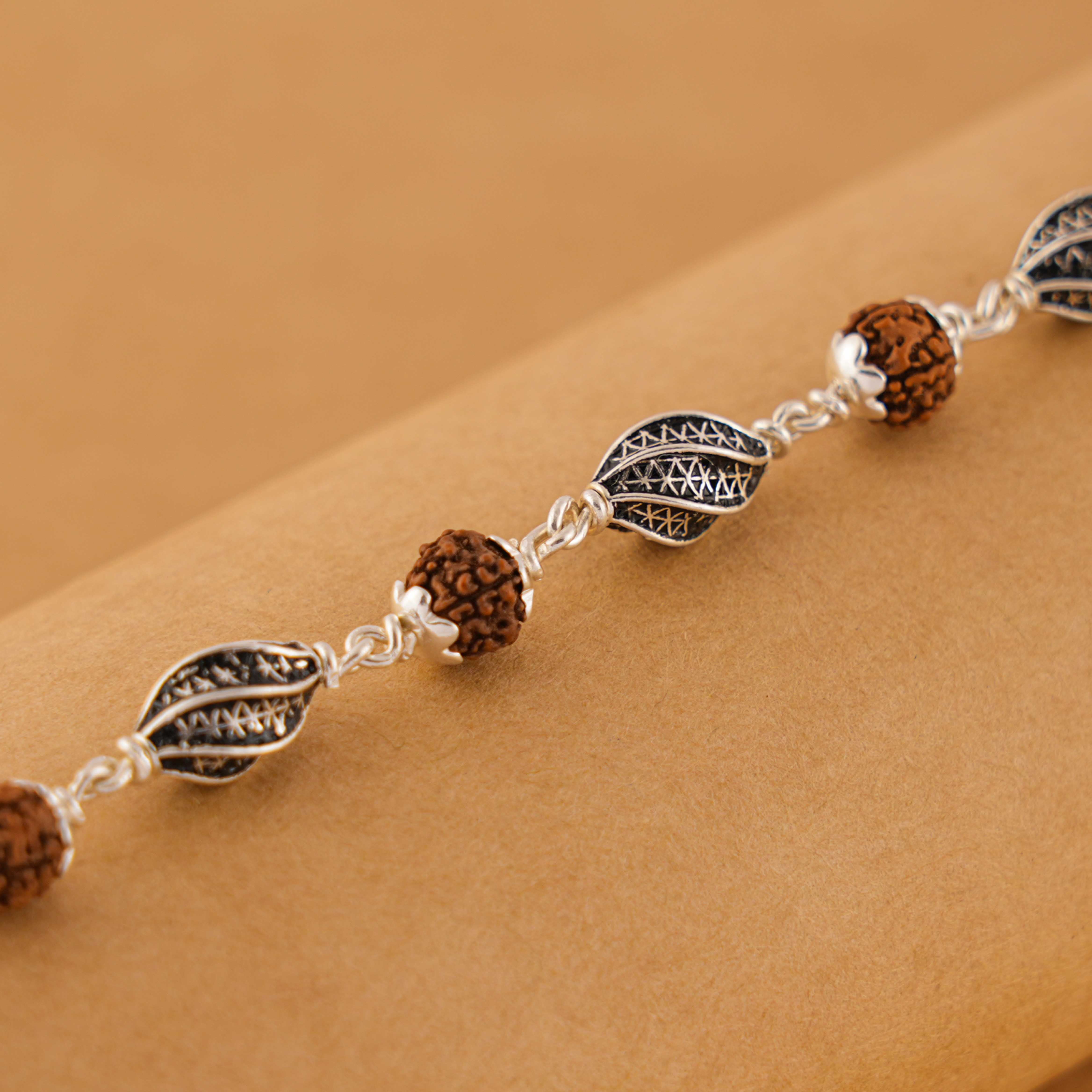 Prinjal Jewellers Rudraksha Silver Marqurise Beads Bracelet.