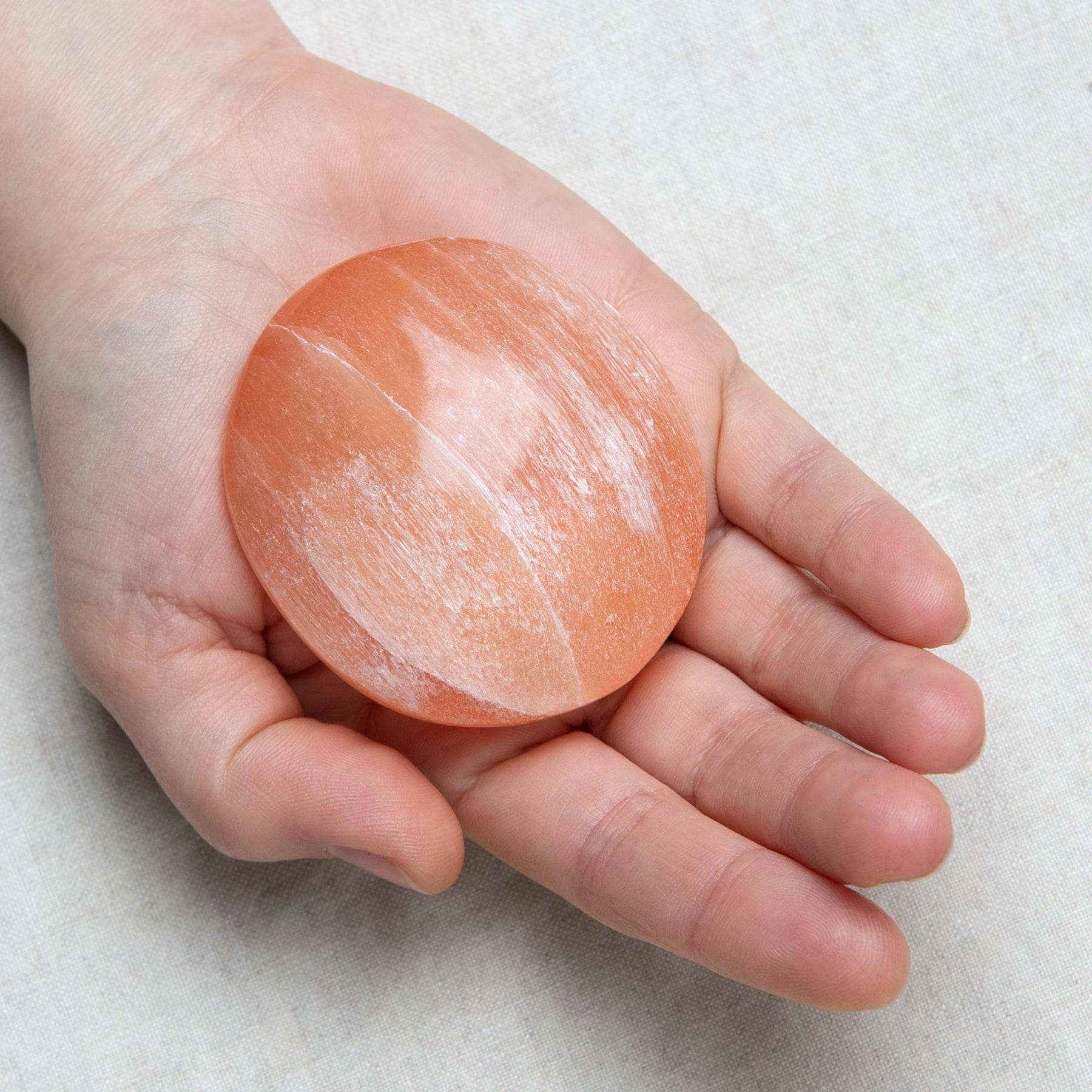 Tiny Rituals Peach Selenite Palm Stone - view 2