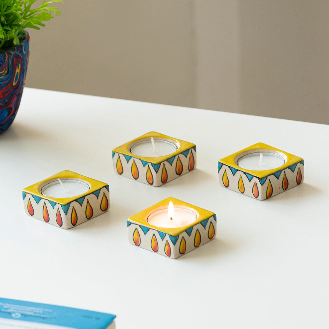 EXCLUSIVELANE 'Mughal Blazing Jugnu' Handpainted Tea Light Holder (Set of 4, Ceramic)