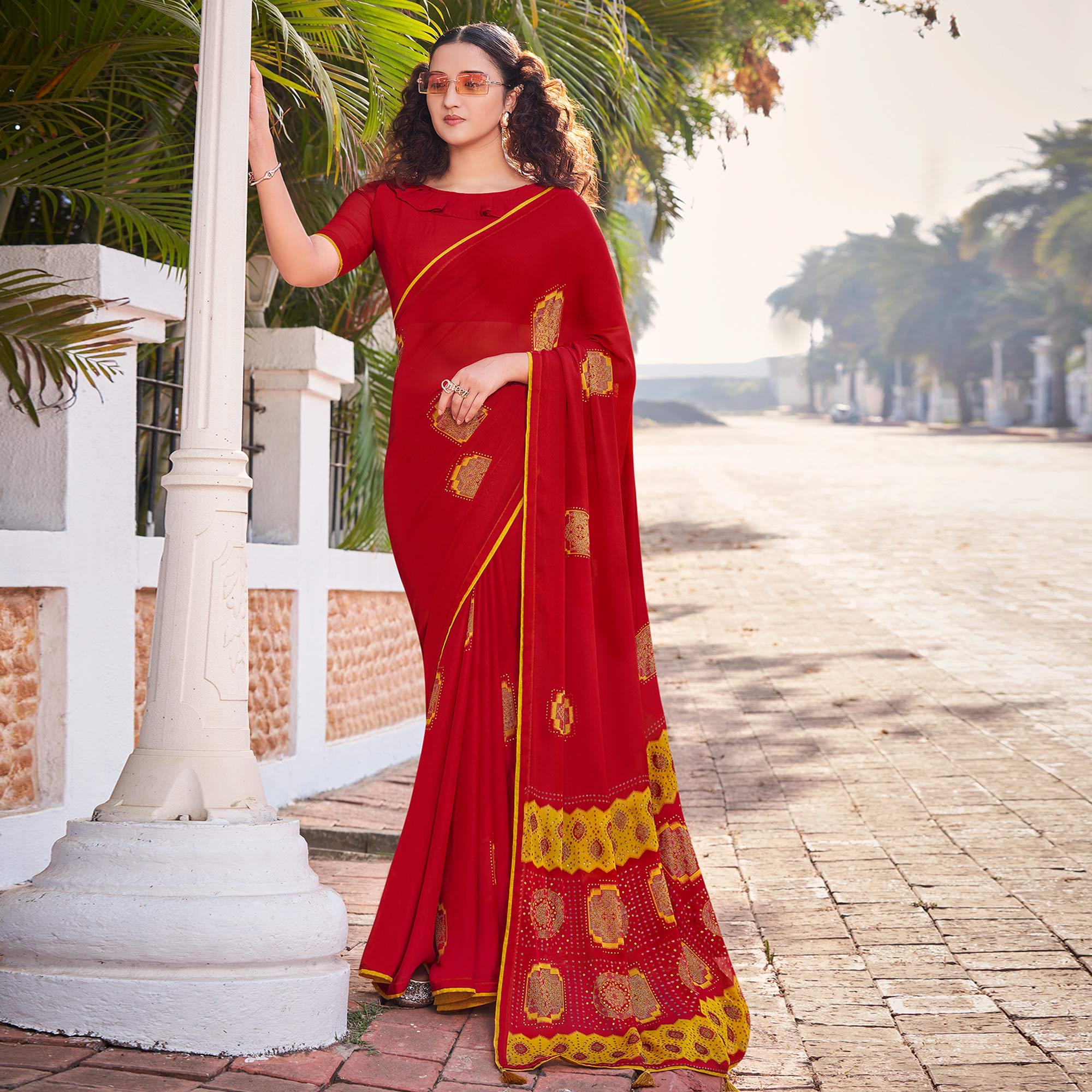 Peachmode Maroon Foil Printed Georgette Saree With Tassels