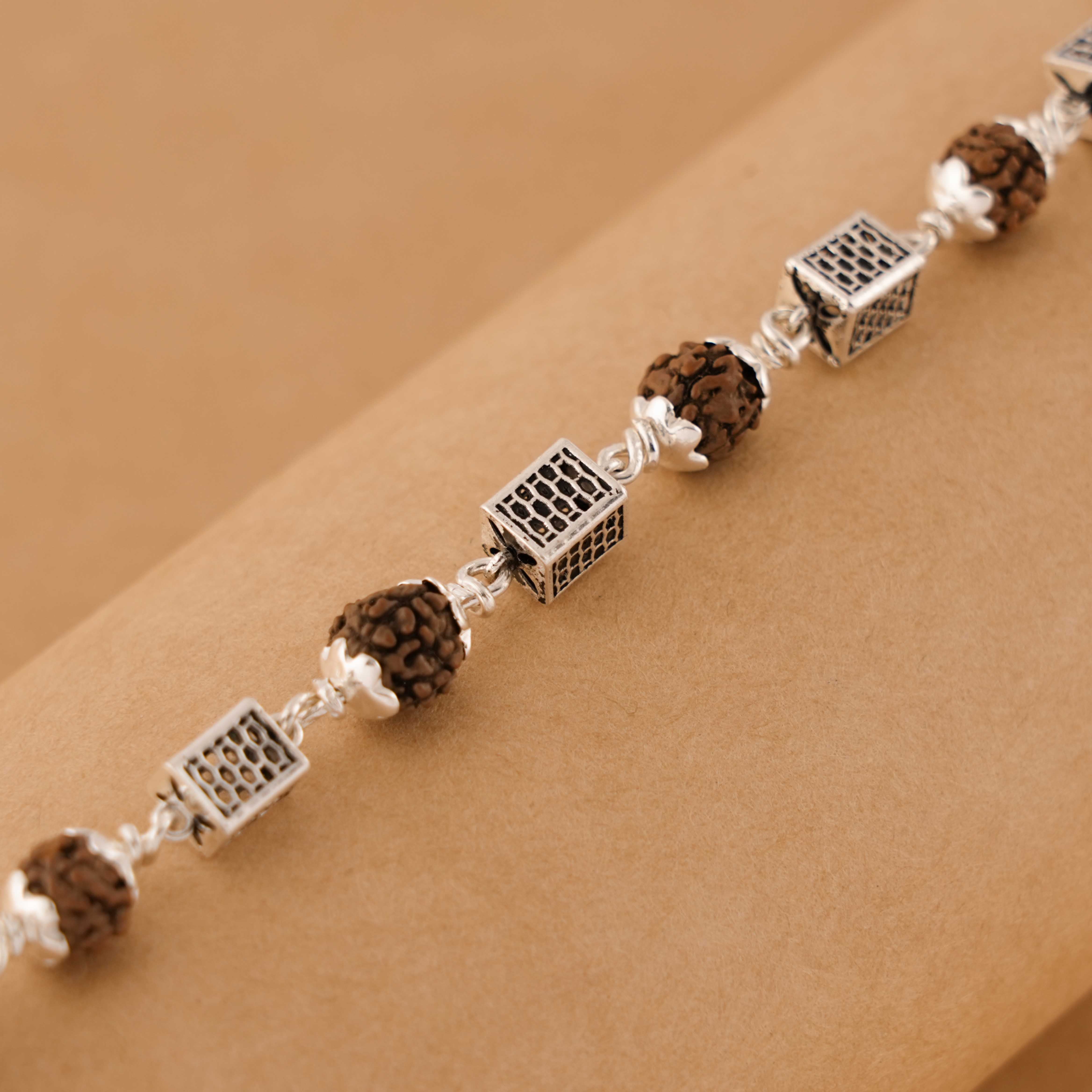 Prinjal Jewellers Rudraksha Silver Square Cylinder Bracelet.