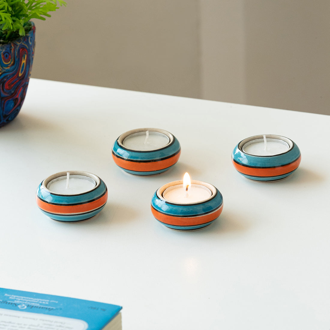 EXCLUSIVELANE 'Mughal Rolling Jugnu' Handpainted Tea Light Holder (Set of 4, Ceramic)