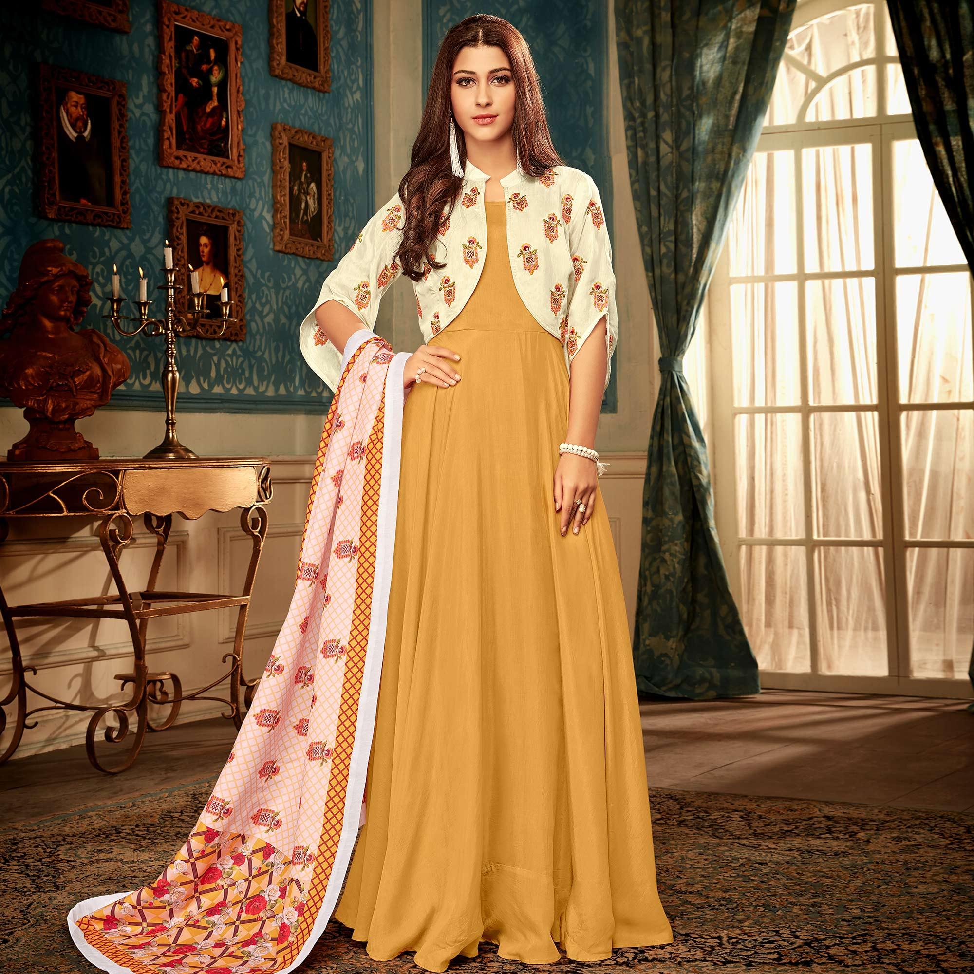 Peachmode Seller Majesty Mustard Yellow Colored Partywear Embroidered Heavy Muslin Gown