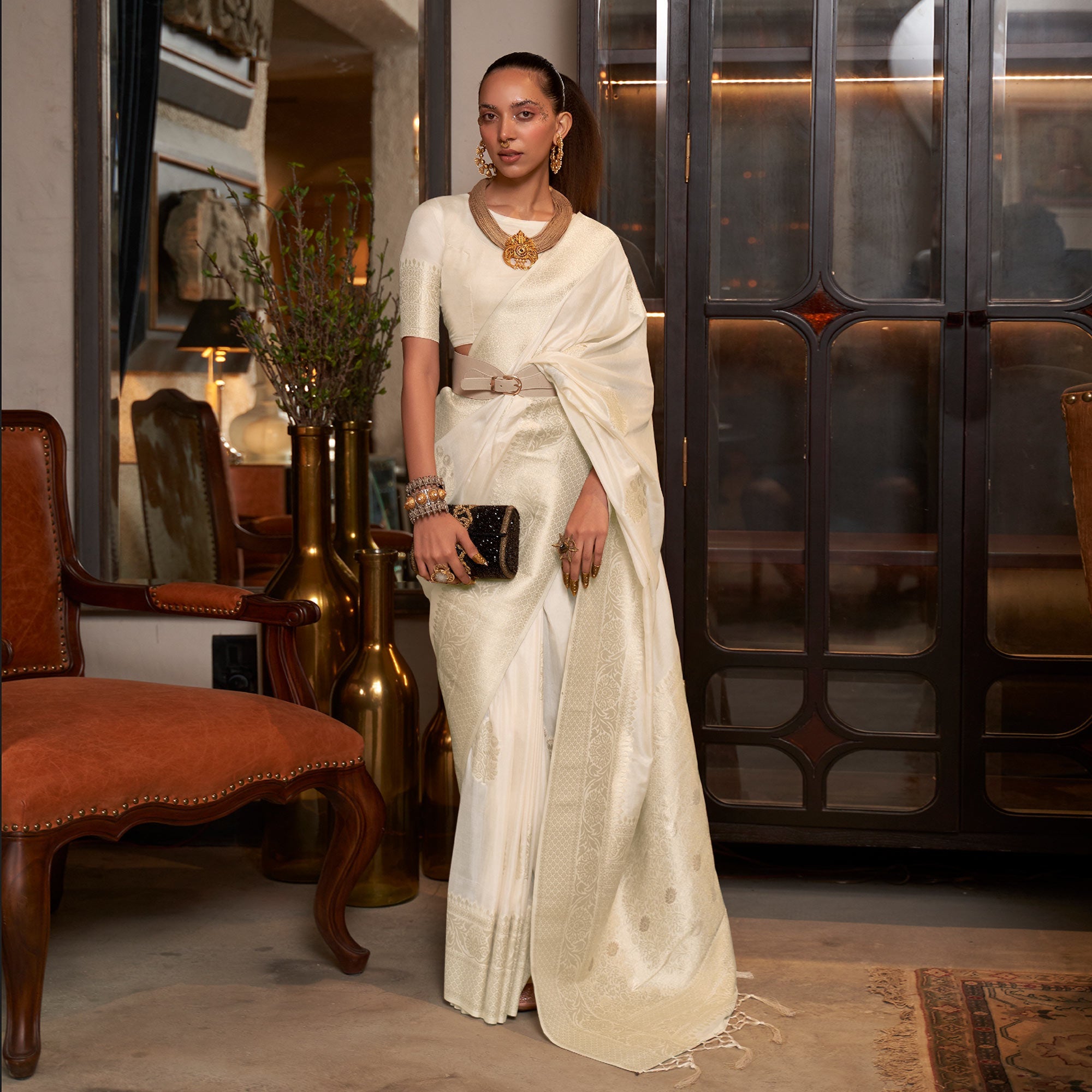 Peachmode Cream Woven Georgette Saree With Tassels