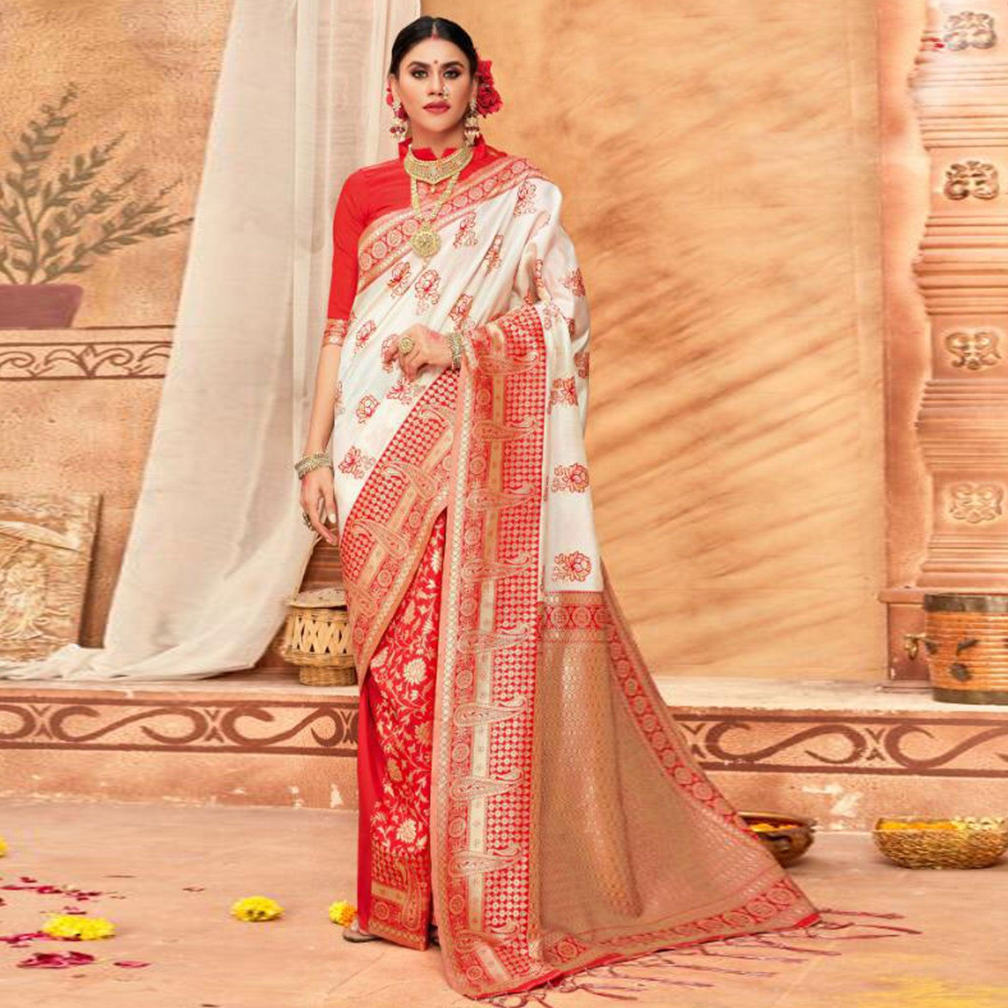 Peachmode Gleaming Cream & Red Colored Festive Wear Woven Silk Blend Saree With Tassels