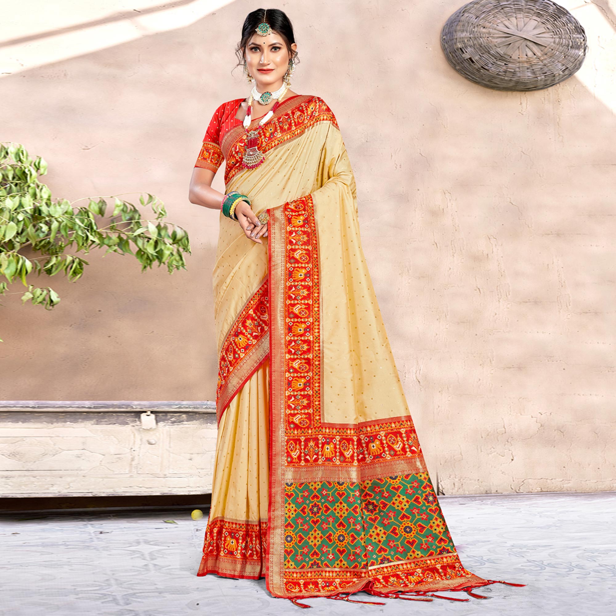 Peachmode Cream Woven Patola Banarasi Silk Saree With Tassels
