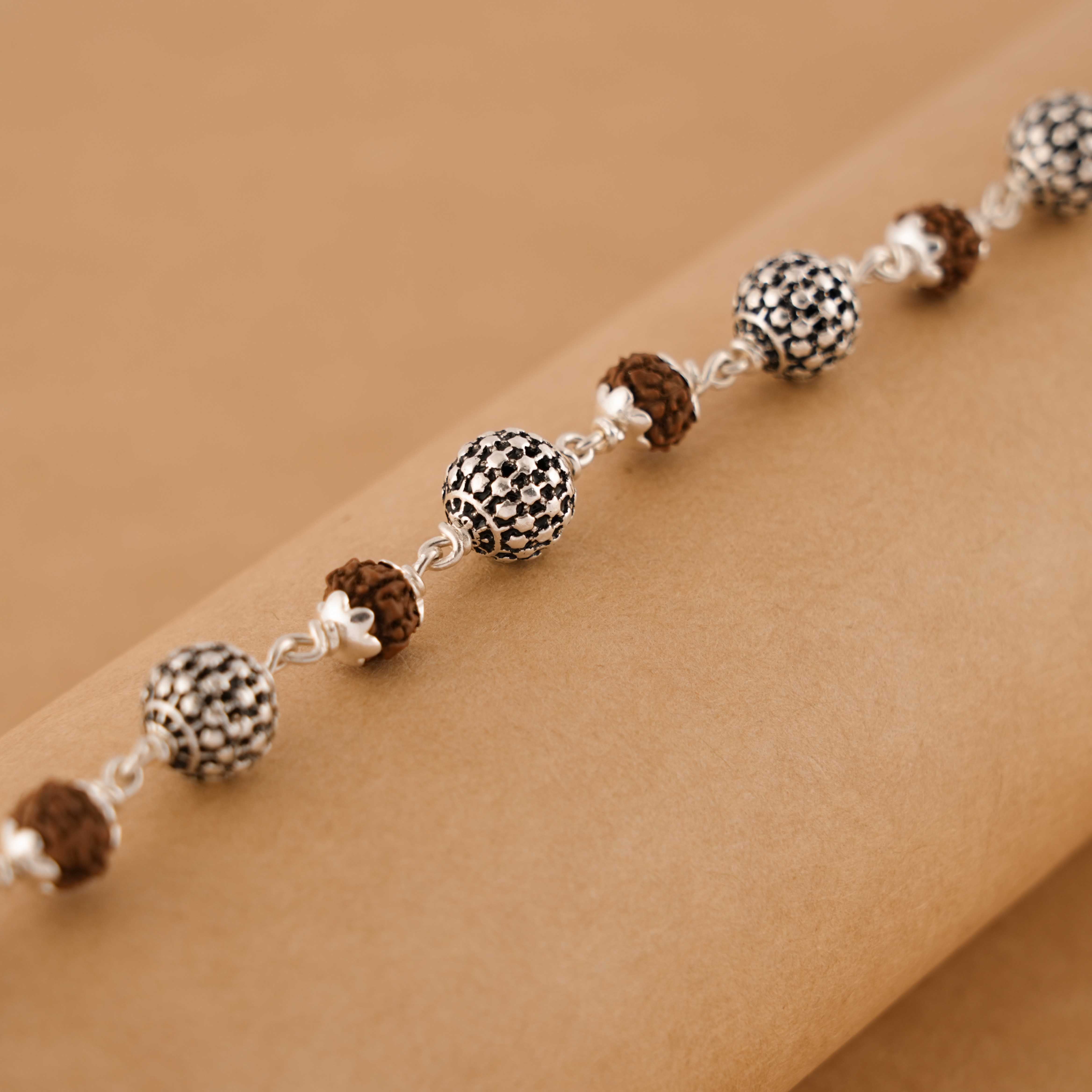 Prinjal Jewellers Rudraksha Silver Hollow Round Beads Bracelet.
