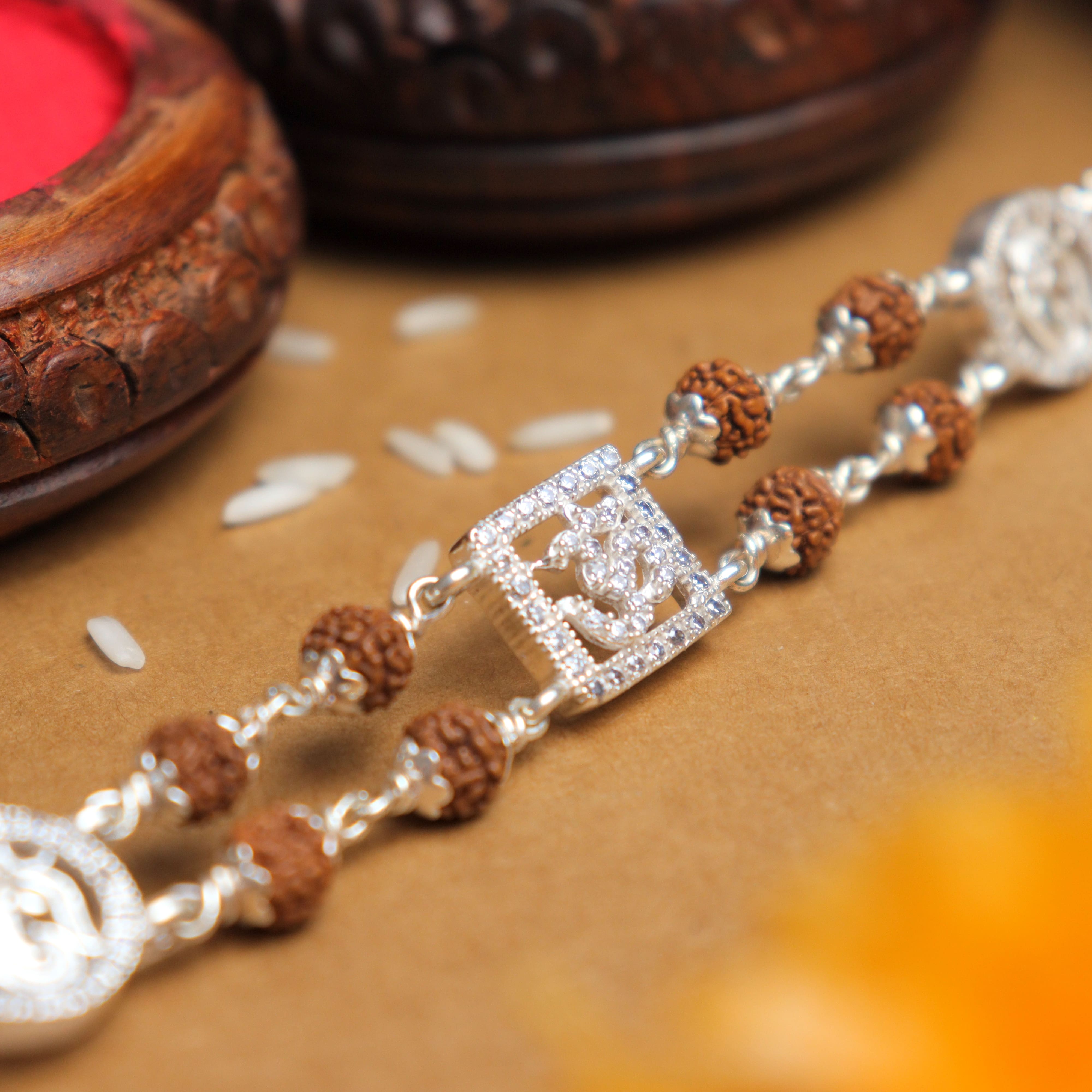 Prinjal Jewellers Silver Rakhi with Rudraksha, Om, and Ganesh, Double Line Design