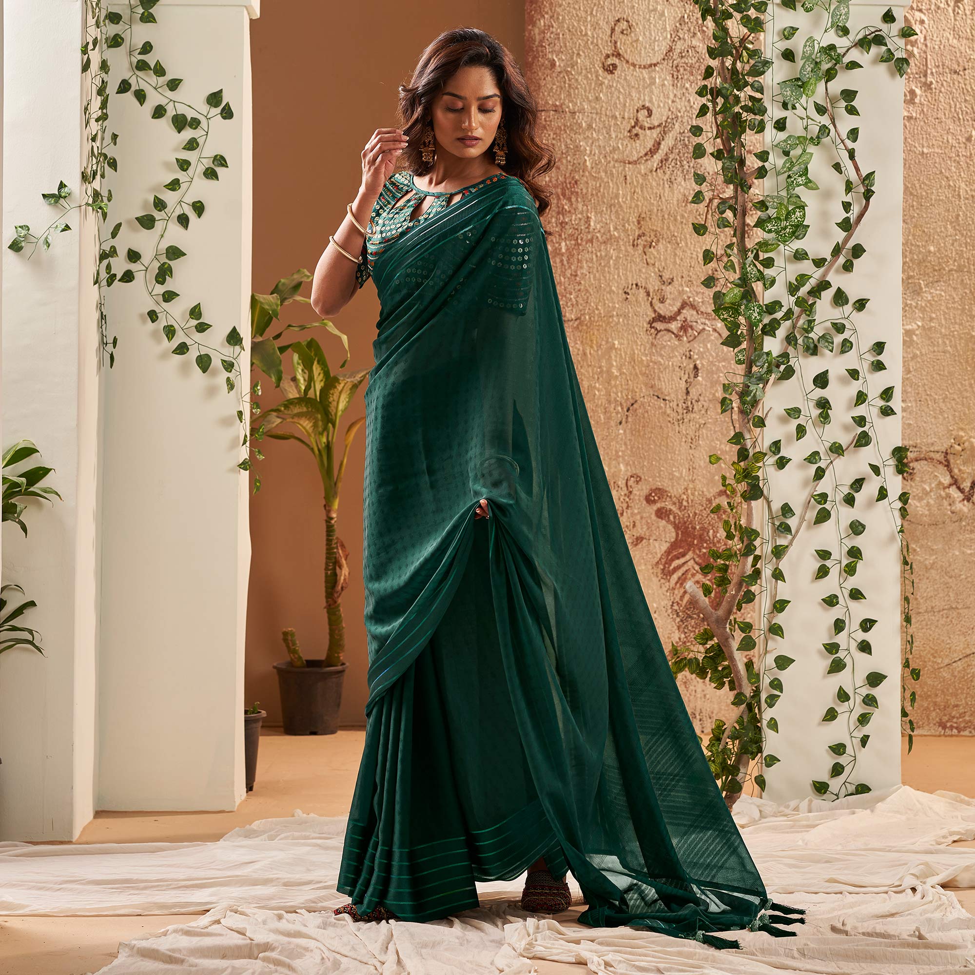 Peachmode Dark Green Woven Georgette Saree With Tassels